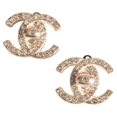 Chanel turnlock earrings by Karl Lagerfeld Fall 1996