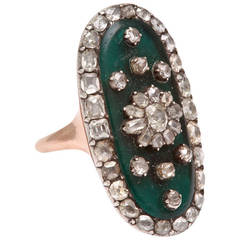 Opulent and Rare Georgian Diamond Ring with Forest Green Background