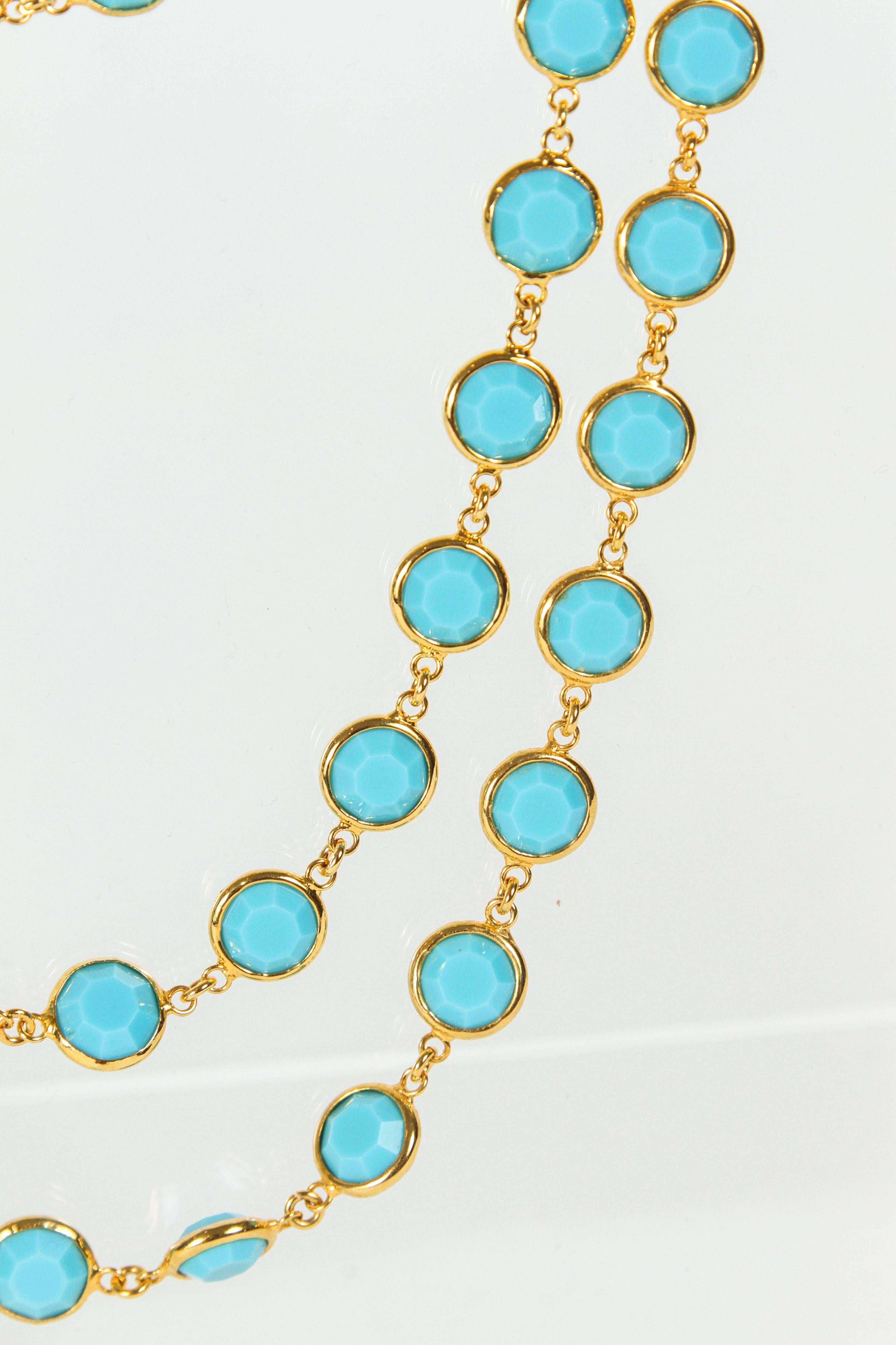 Lovely Chanel suitor with faceted turquoise stones (glass) set in gilt metal bezels. This necklace is in amazing condition. An oval tag is imprinted with 