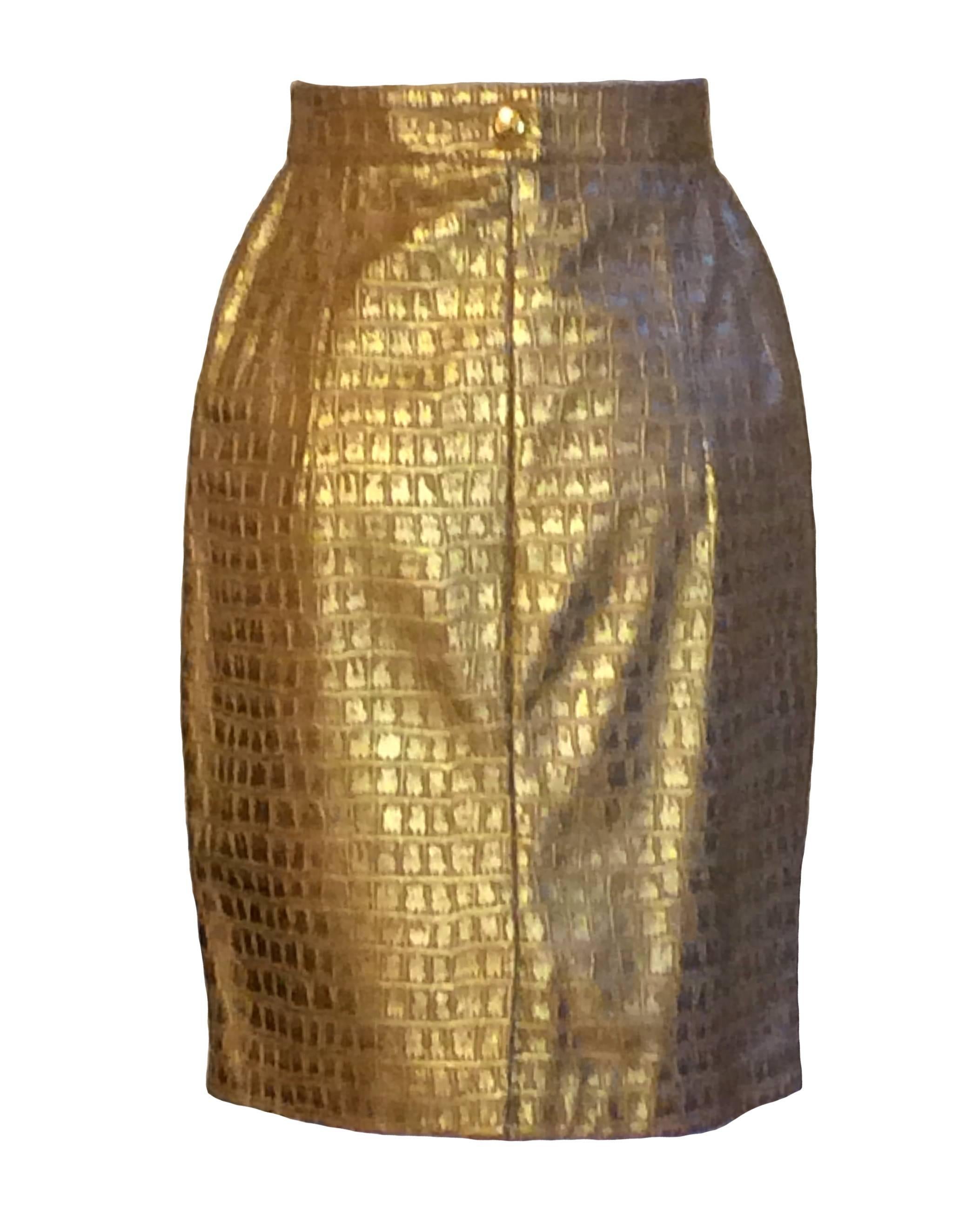 Escada by Margaretha Ley vintage 1980s leather skirt with metallic gold crocodile embossing. Back zip and snap.

Made in Germany.

Size FR 34, approximately US 2. 
Waist 25 1/2