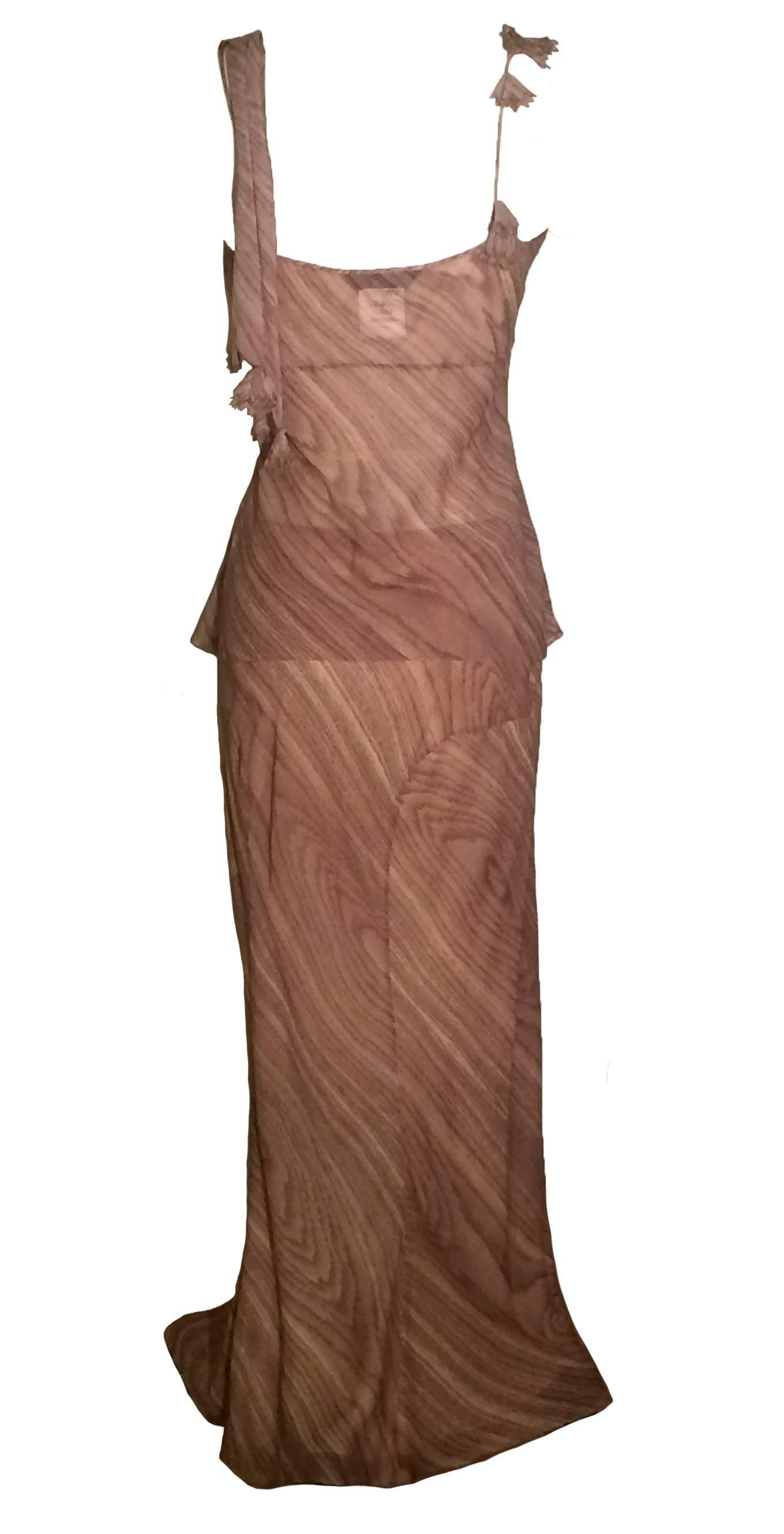 John Galliano Paris tan wood grain print maxi skirt and tank forming a gown like set. Fourteen small cloth covered buttons at side hip close skirt. 

100% silk.

Made in France. 

Top: US Size 8.
Bust 36