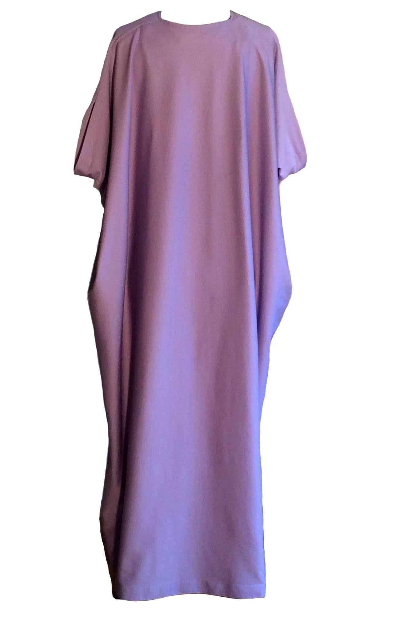 Halston IV 1970's lavender caftan. A fun example of Halston's later design-for-the-masses. Made of a very cool knit fabric that feels like a super-light neoprene. A great cover up for pool side lounging, just add some big shades!

One size fits