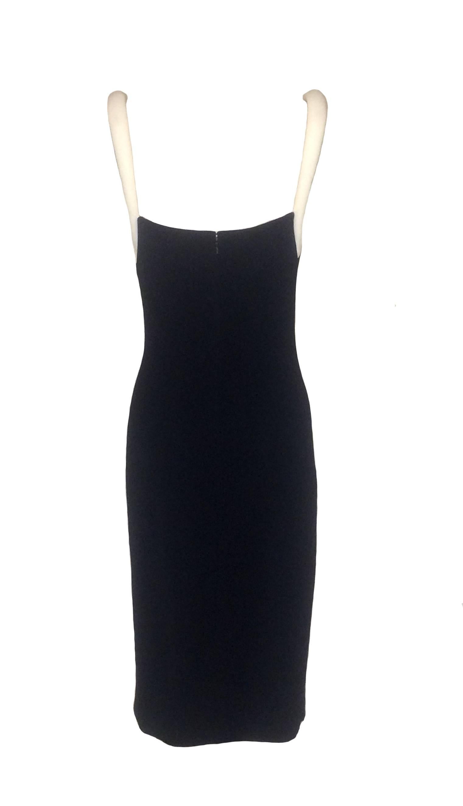 Gianni Versace Couture 1990s slinky black jersey midi dress with round white padded straps. Slight drape at chest, slit on one side of skirt. Back zip and hook and eye, fully lined, extra/more structured lining at bust. 

Versions seen on fall 1997