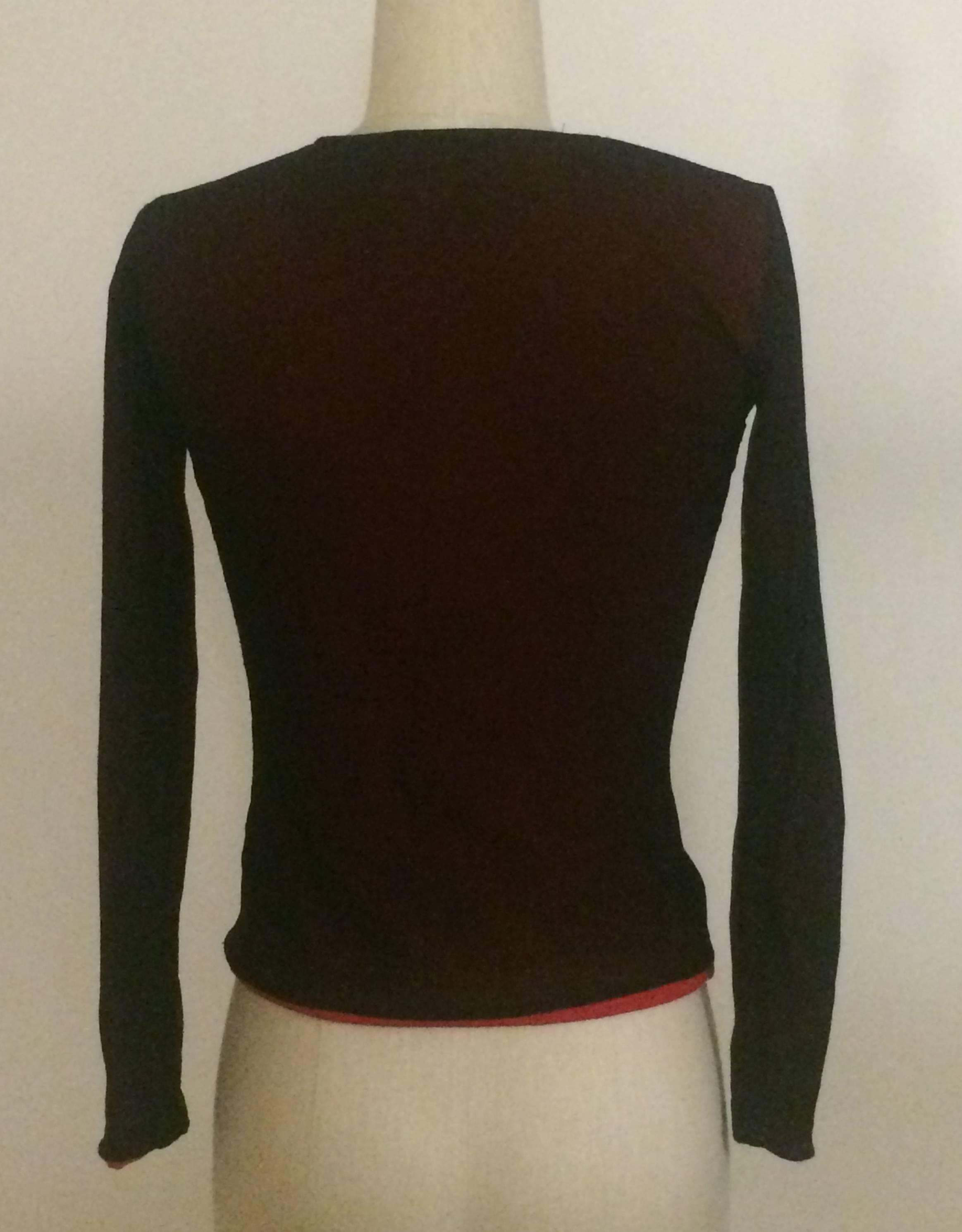 Moschino Cheap & Chic 1990s red long sleeved top with 'Quit Staring at My T-Shirt' printed under super-fine black mesh. 

Layer 1: 100% polyamide.
Layer 2: 87% polyamide, 13% spandex.

Made in Italy.

Size IT 38, best fits XS. Very stretchy,