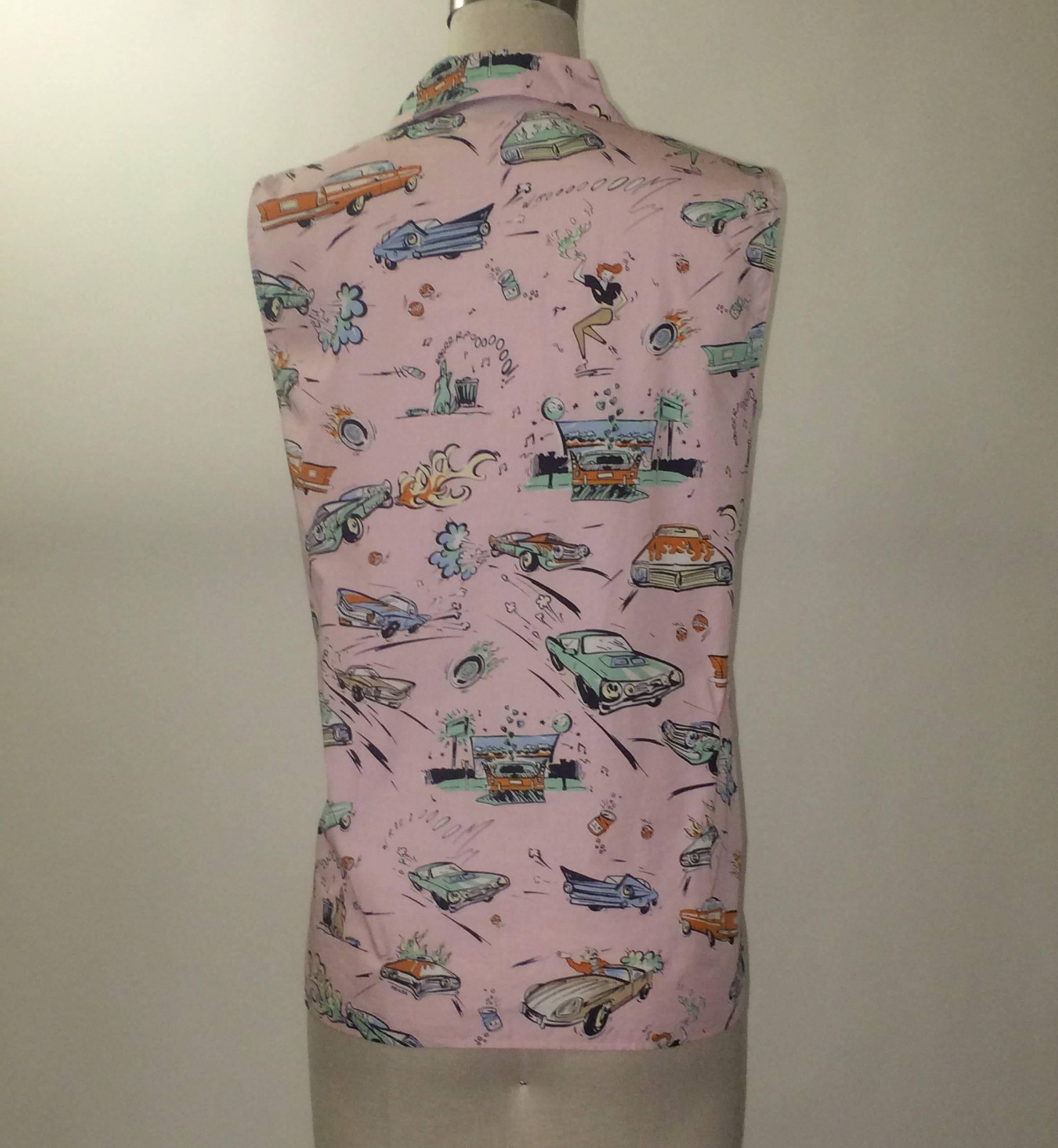 Prada pink hot rod print sleeveless blouse. Buttons up front with cloth covered buttons. Looks great tied at waist and paired with a dark skinny jean or full skirt.

100% cotton.

Made in Italy.

Size IT 42, approximate US 6.
Bust 36