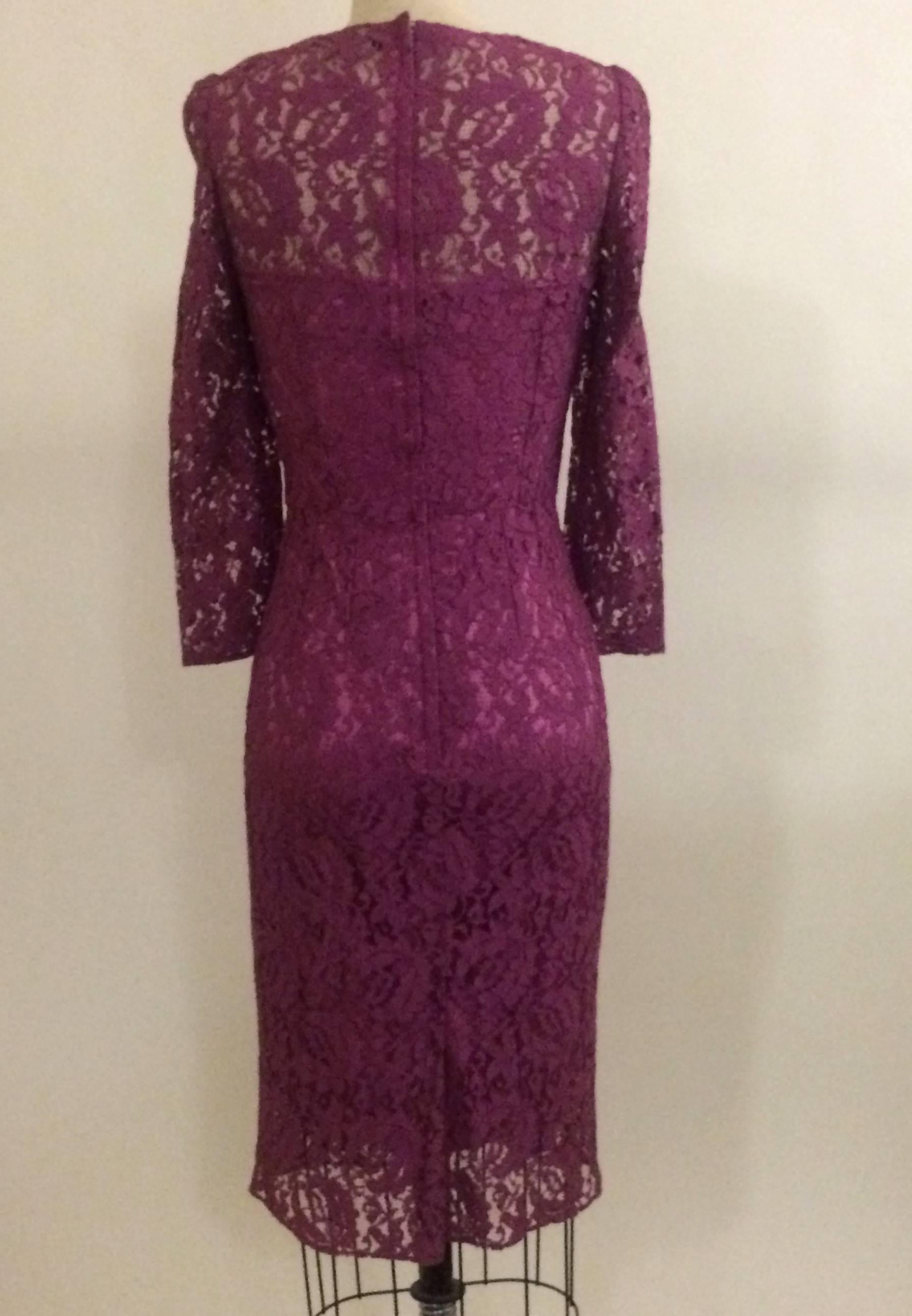 Dolce & Gabbana 3/4 sleeve purple lace fitted dress. Attached silk slip. Hidden back zip and hook.

90% rayon, 10% nylon.
Slip 96% silk, 4% elastane.

Made in Italy, size IT 38, US 2. Runs small, see measurements. 
Measurements taken