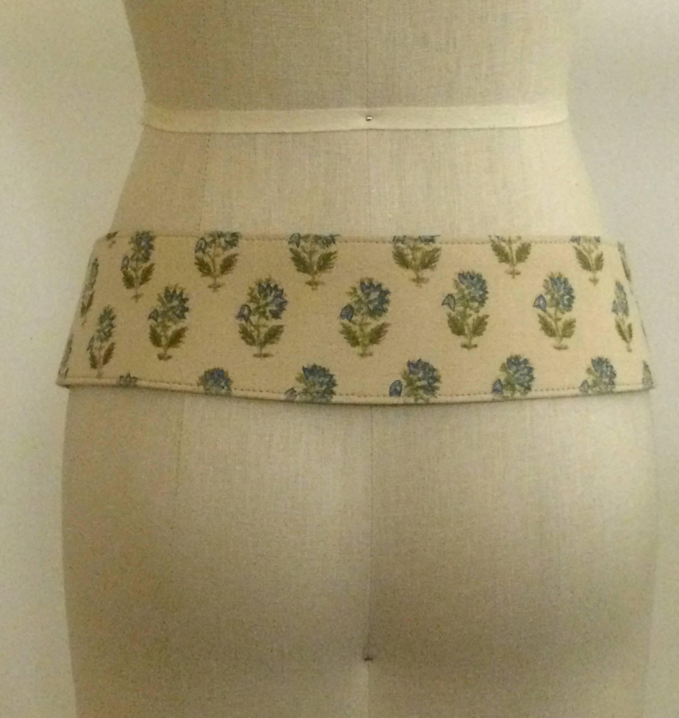 Oscar de la Renta 1990s natural cream canvas belt with blue flowers printed throughout, small blue stitch detail on each flower. Brown leather buckle. Leather backing. 

Super cute slung over a waistless cotton dress with matching leather flip flops