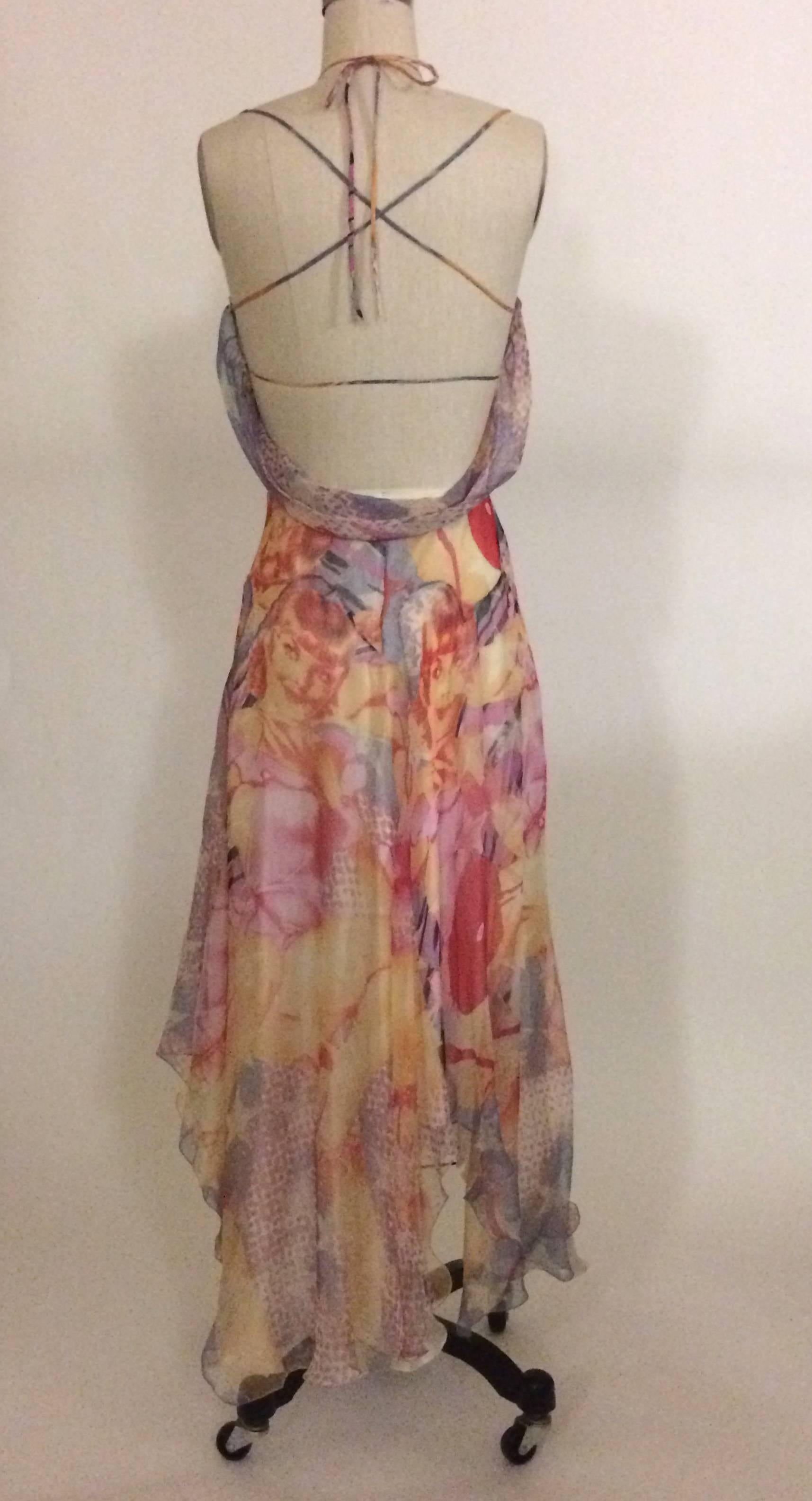 Alexander McQueen 2003 rare multicolored silk chiffon dress with pin up print throughout. Low draped back with strap detailing. Pleating and raw edged ruffle trim at bust. 

Built in cups. Pull-on. Ties at back neck, then fastens with crossed straps