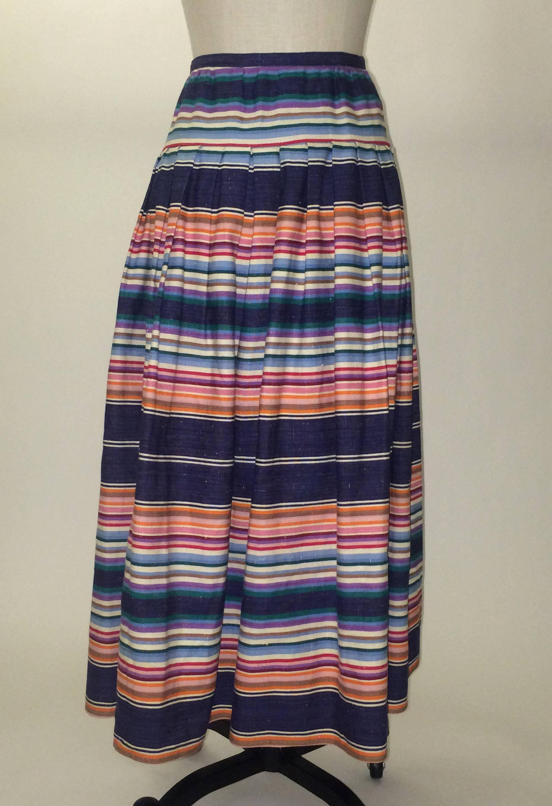 Giorgio Sant'Angelo 1980's navy skirt with orange, pink, turquoise, blue, and purple stripes. Slightly nubby texture throughout the weave. Back zip. Perfect for summer with a chunky open knit sweater or just a t-shirt! 

No content label, feels like