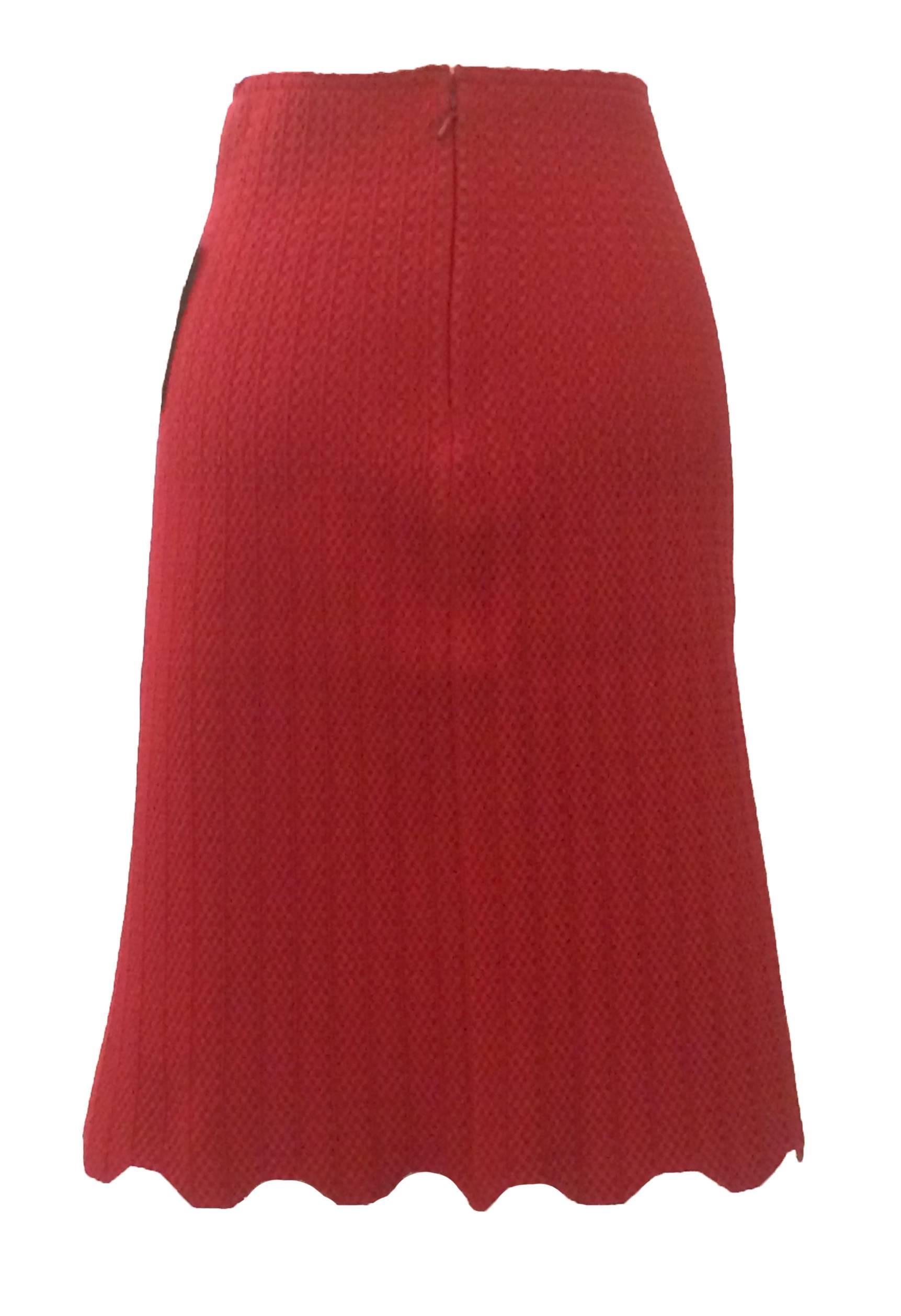 Deep red Alaia stretch knit skirt with an amazing stretchy texture, vertical detailing, and scalloped hem. Back zip and hook and eye.

Made in Italy.

Size 36, fits like S. Measurements taken unstretched, skirt is very stretchy.
Waist