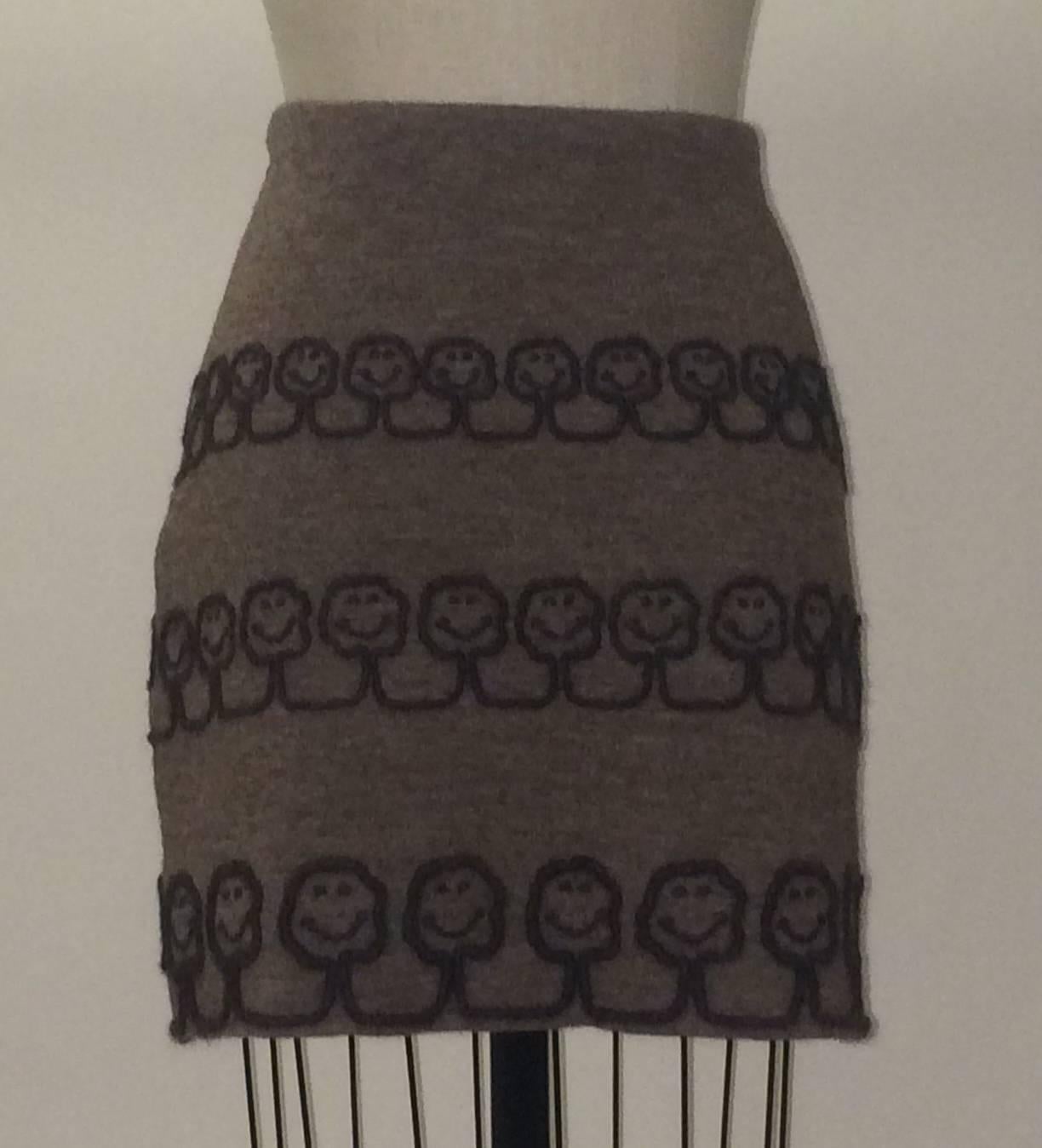 Moschino light brown knit skirt with dark brown smiling trees appliquéd in yarn from Eco-Couture, Moschino's 'Nature Friendly Garment' line, unveiled in Franco's last collection. Fully lined, side zip.

100% wool.
Fully lined in 100% rayon. 

Made
