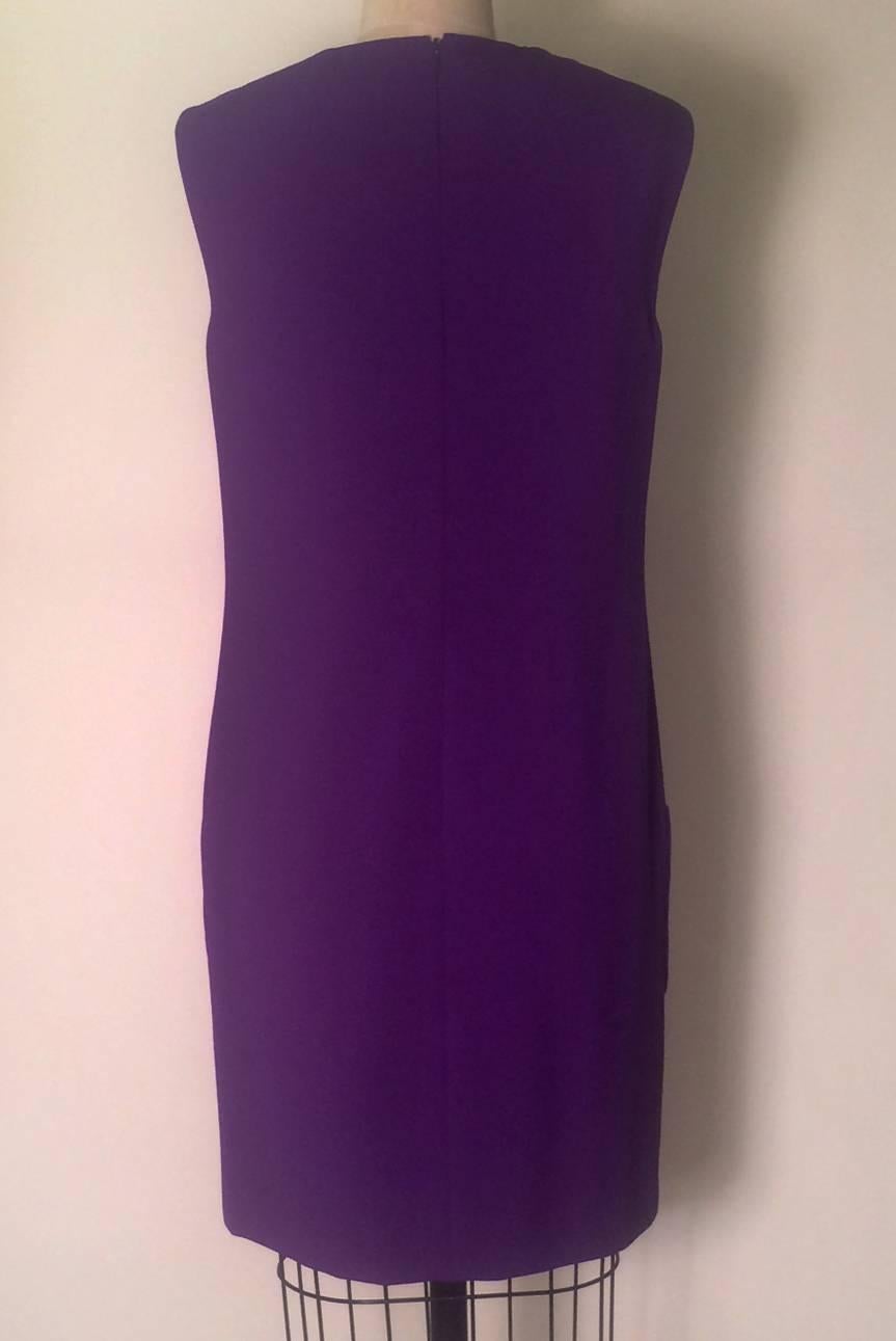 Gianni Versace Couture vintage 1990s straight-cut purple sleeveless shift dress with four patch pockets at front. Medusa logo lining. Back zip and hook.

94% wool, 6% silk.
Fully lined in 100% rayon.

Made in Italy. 
Size IT 40, approximate