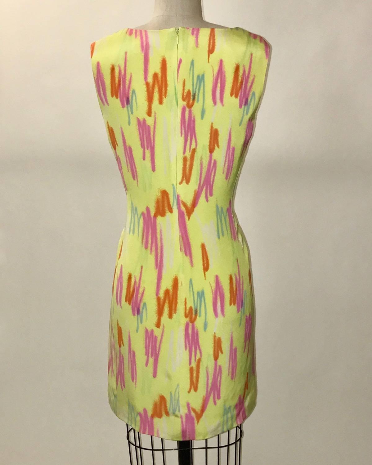 Gianni Versace Couture 1990s yellow sleeveless dress with square neck fluorescent colored scribbles throughout. Back zip. 

No content tag, feels like a silk blend.

Size IT 44 (would usually approximate to US 8, but runs a size or two