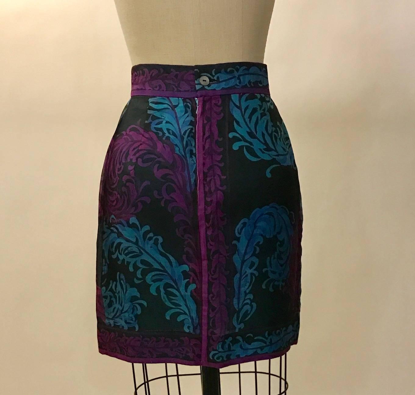 Emilio Pucci black silk skirt with magenta and blue floral print. Signed 'Emilio' throughout. Estimated circa 1990s. Back zip and button. 

100% silk.
Fully lined in 100% rayon.

Made in Italy.

Size IT 40, approximate US 4, but runs small. See