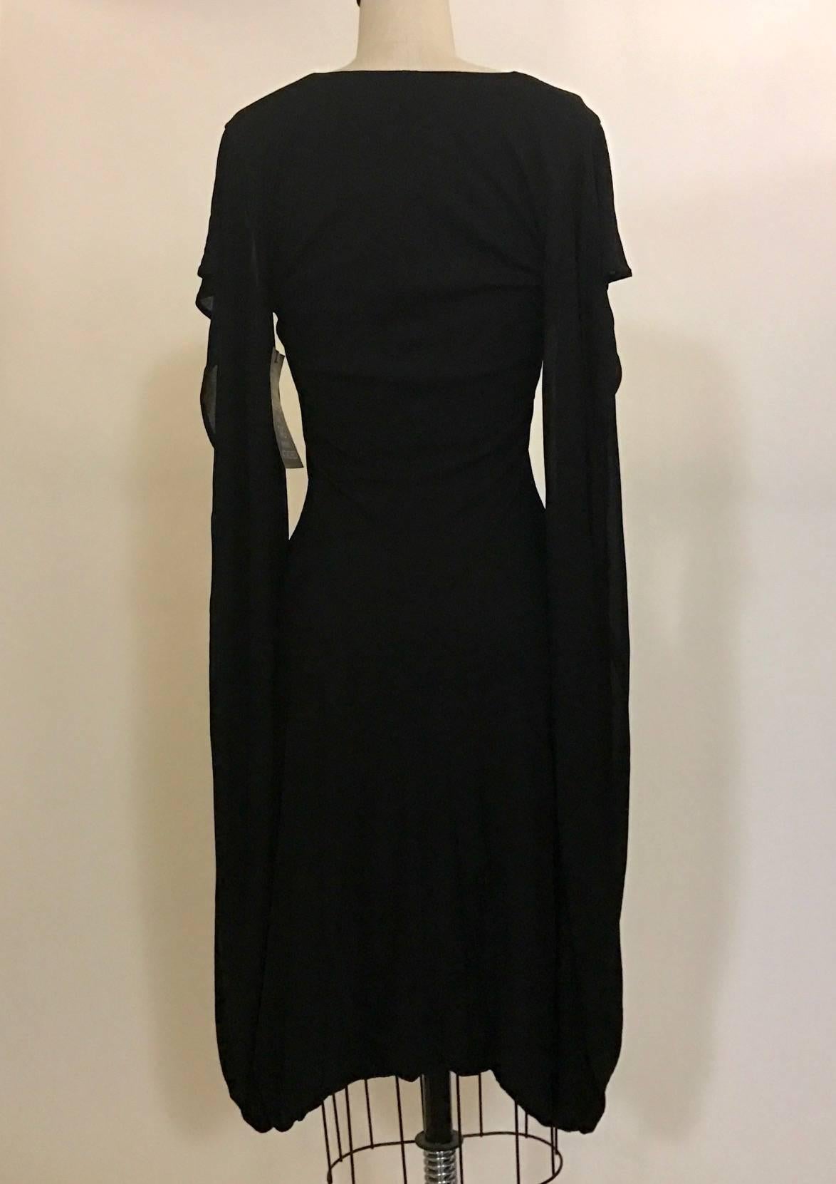 Alexander McQueen 2009 fitted black jersey v neck dress. A short bat-wing sleeve extends all the way down and connects to the draped skirt. Slight bubble hem. A true piece of cutting and draping genius!

100% rayon.

Made in Italy.

Labelled size IT