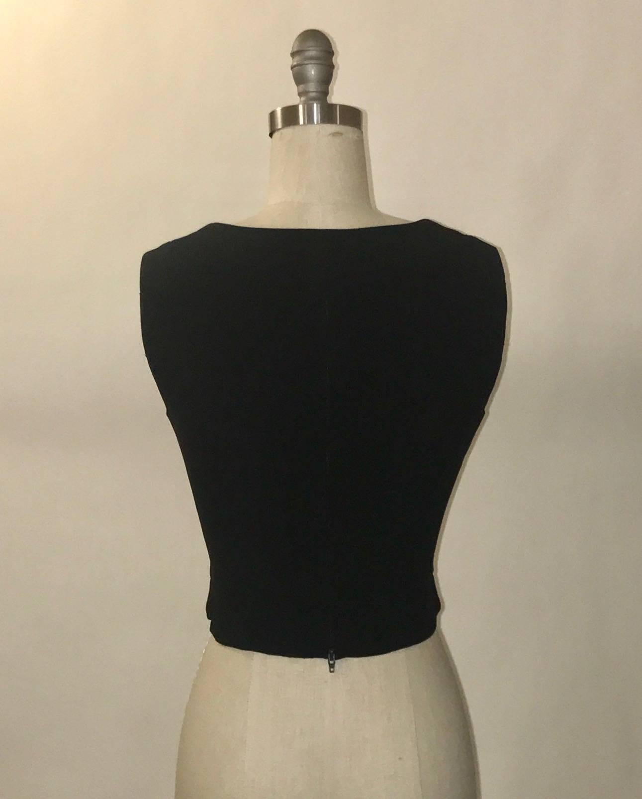 Moschino COUTURE! Repetita Juvant black vest with lace up front circa approximately 1993. Back zip. 

53% acetate, 47% rayon.
Fully lined in 60% acetate, 40% rayon.

Made in Italy.

Labelled size IT 44, US 10. Best fits modern 6/8, see