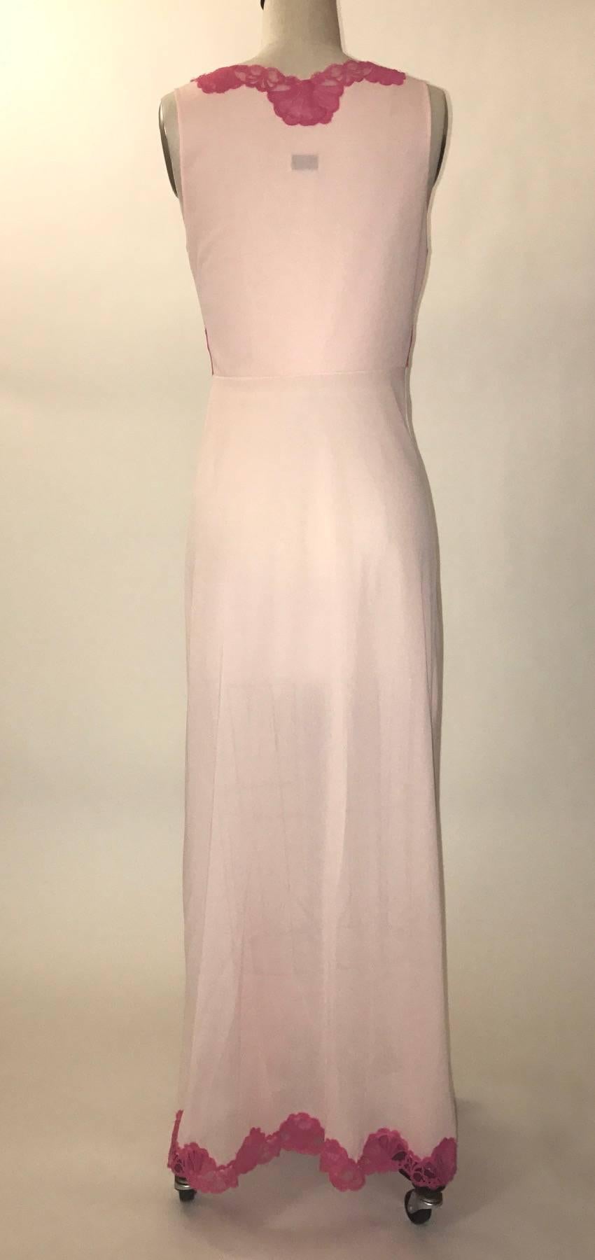 Emilio Pucci vintage 1960s semi sheer light pink long slip with hot pink lace trim at bodice and hem.

No content label, feels like nylon/synthetic.

Labelled size S.
Bust 34