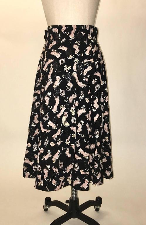 Louis Vuitton Black and Pink Mask, Glove, and Shoe Print Midi Skirt at 1stdibs
