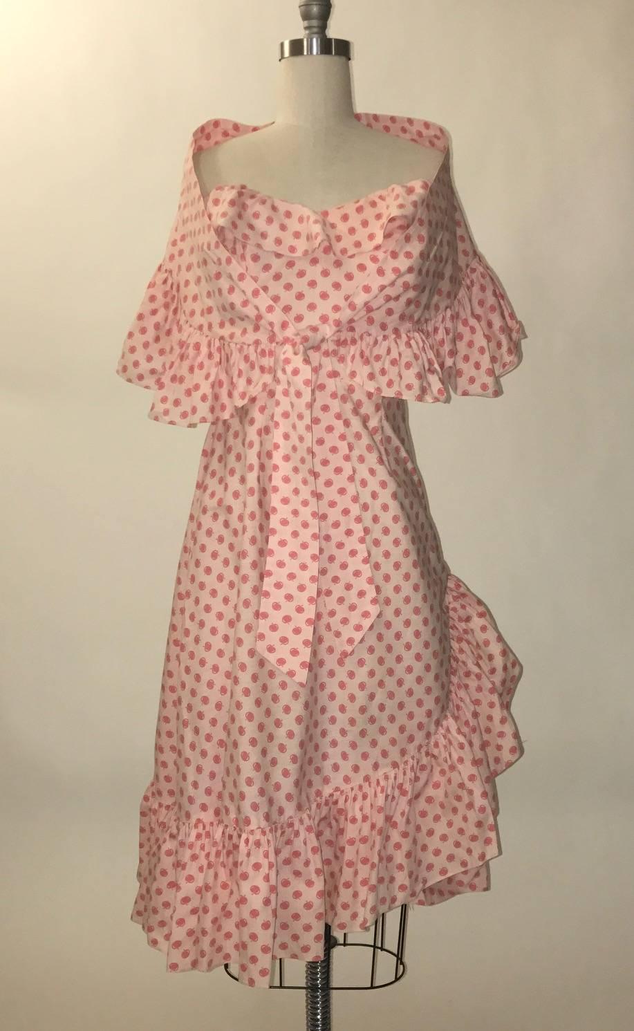 Margaret Newman 1950's light pink ruffle trim dress with darker pink fruit print. 
Matching shawl included. Perfect for a summer picnic! Metal back zip and two hook and eyes.

No content label, feels like cotton.

No size label, we'd say best fits