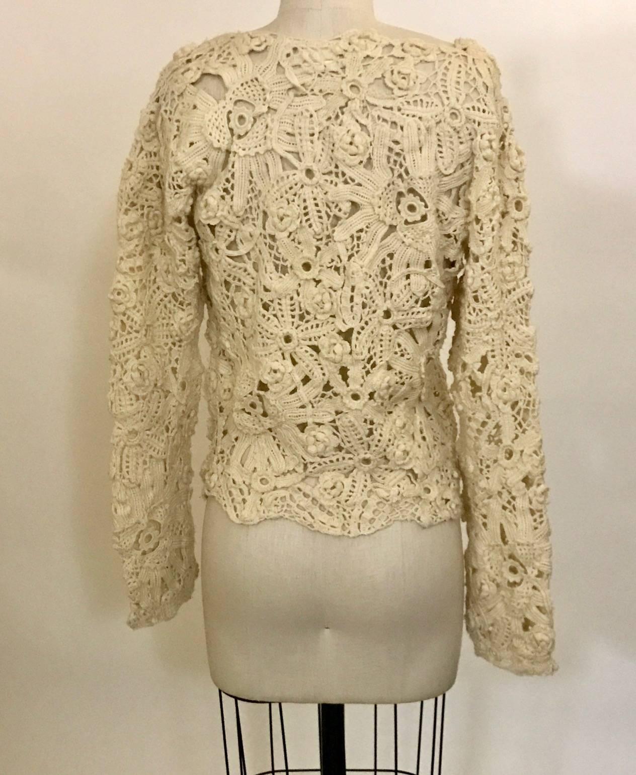Comme des Garcons long sleeve floral crochet cream sweater. Open knit. Color best represented in close up of label.

No content label, feels like acrylic blend.

Made in China.

Size M. 
Bust 36