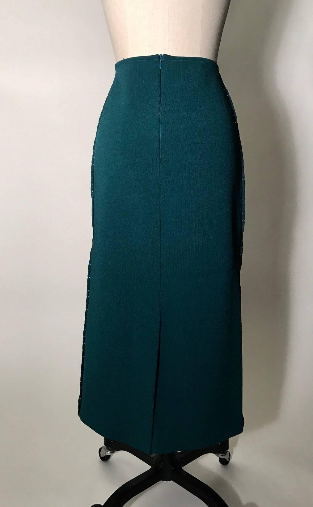 Oscar de la Renta teal knit body con skirt in a longer midi length. Scalloped trim at sides. Back slit and zip. 

Labelled resort 2013, but was featured in the Fall 2013 runway show, look 4.

50% silk, 50% cotton.
Unlined.

Made in Italy.

Labelled