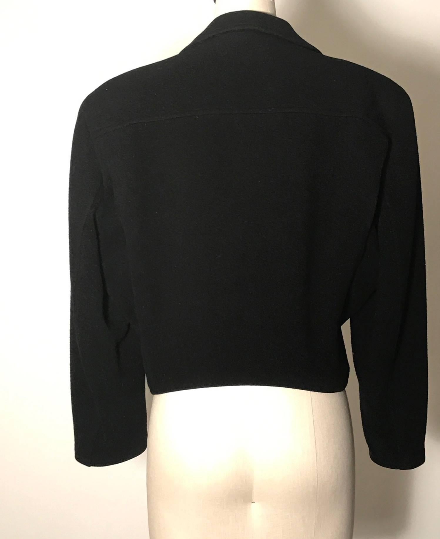 Vintage 1980s black wool biker jacket from Stephen Sprouse's Sprouse line. Asymmetrical styling with three zipper pockets at front, one mini flap pocket, zip closure, and zipper detailing at cuffs. 

100% wool.
Fully lined in a satiny fabric.

Size