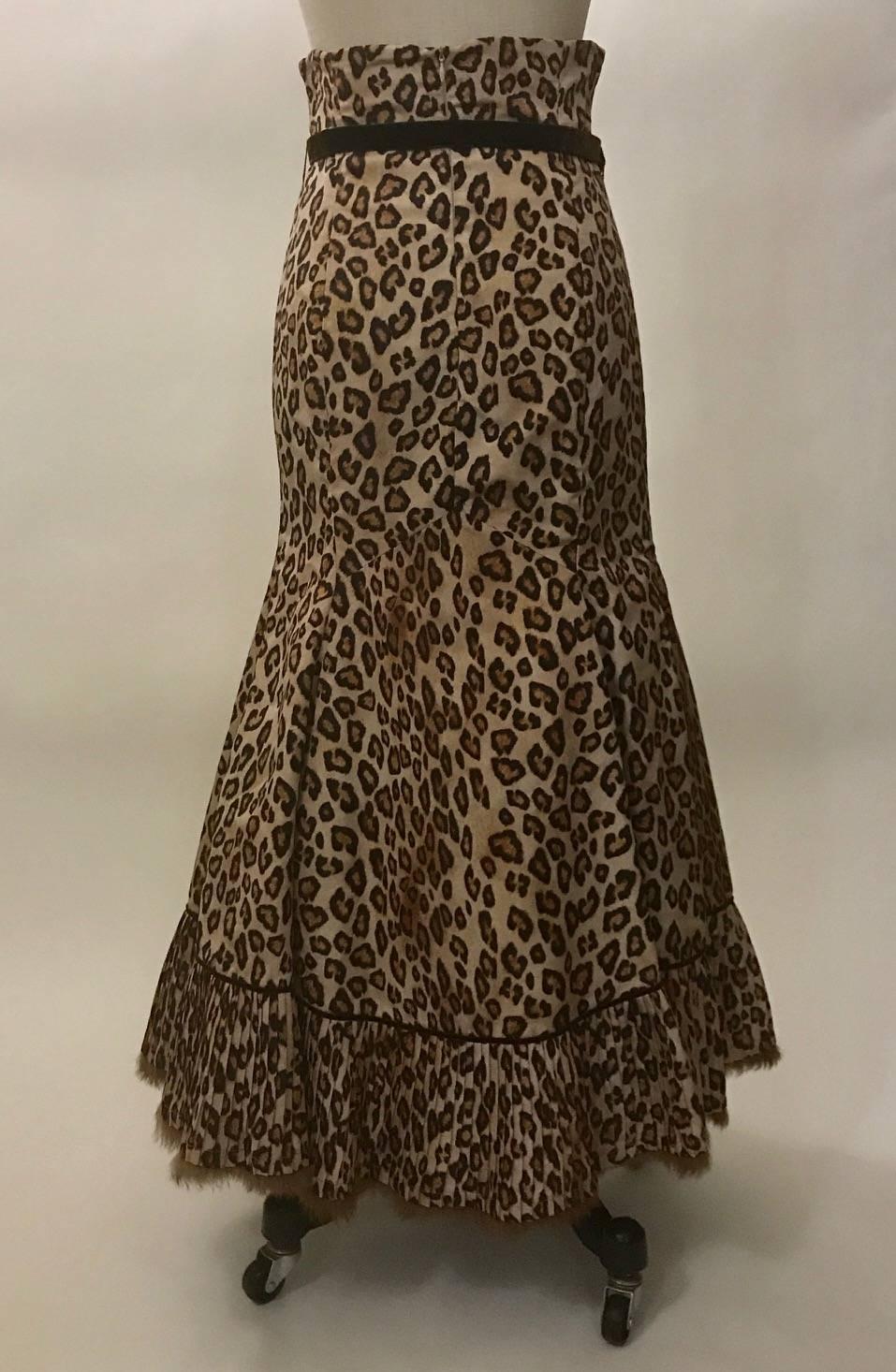 Alexander McQueen leopard midi/maxi skirt from the 2005 Hitchcock inspired collection 'The Man Who Knew Too Much.' Brown velvet trim and pleating at bottom, hem finished with light brown rabbit fur trim. Brown velvet belt. Mesh lining at bottom