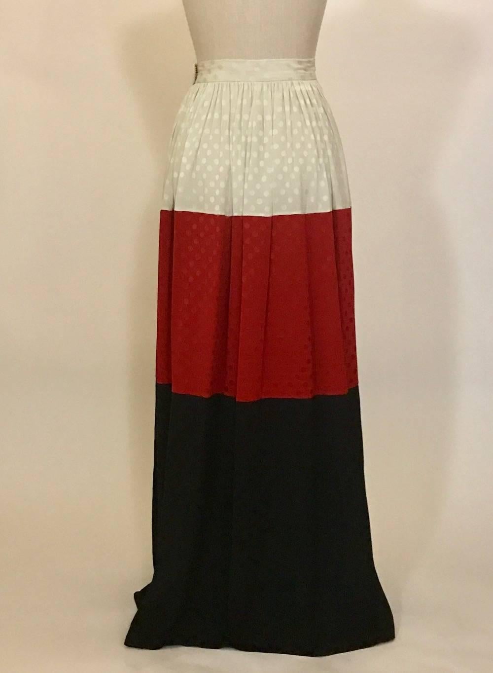 Michaele Vollbracht 1980s silk maxi skirt in a red, white, and black colorblock design with subtle polka dot texture. Fastens at waist with hook and eye.

100% silk.



Labeled size 4, but best fits 0 see measurements.
Waist 24