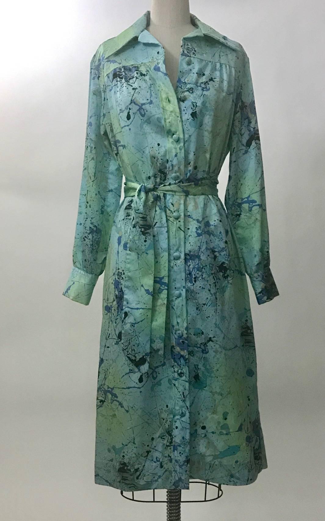 Vintage 1960s Lanvin wide collared shirtdress in robin's egg light blue with a blue and pale mint green splatter paint design slightly reminiscent of Jackson Pollock. Button front, removable belt, buttons at cuffs. 

Content label faded, likely