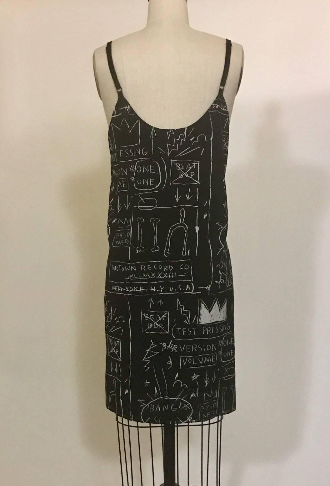 Alice & Olivia black and white graffiti print slip dress from their limited edition Jean Michel Basquiat collection. Pulls on. adjustable shoulder straps.

94% silk, 6% elastane.
Fully lined in 94% polyester, 6% elastane. 

Size L.
Bust 38