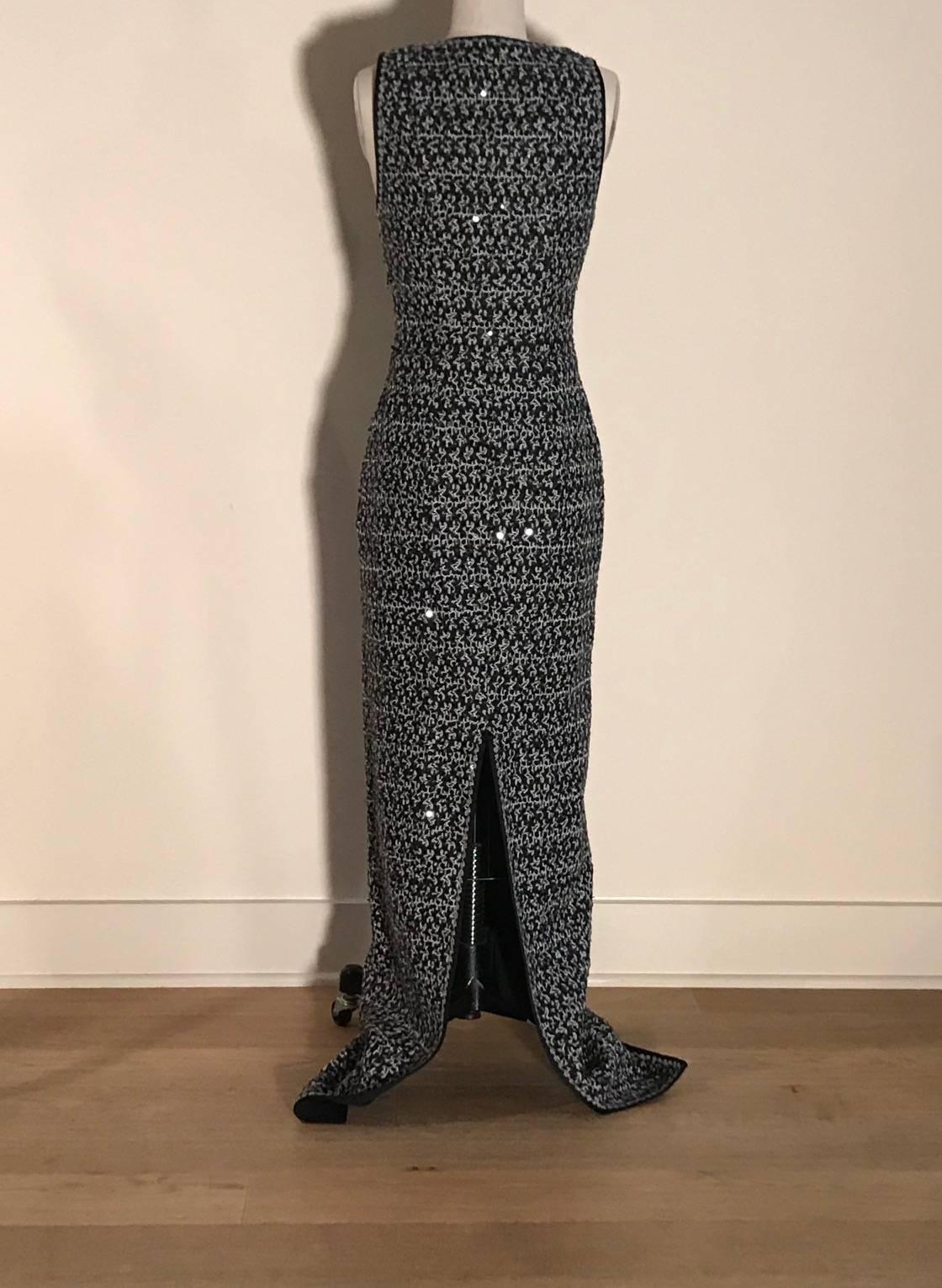 Missoni black and white knit maxi dress with black sequin accents throughout. Partial side zip. 

70% wool, 30% rayon.
Fully lined in 80% nylon, 20% elastane.

Made in Italy.

Size IT 40, seems to best fit US 2. Slightly stretchy, measurements taken