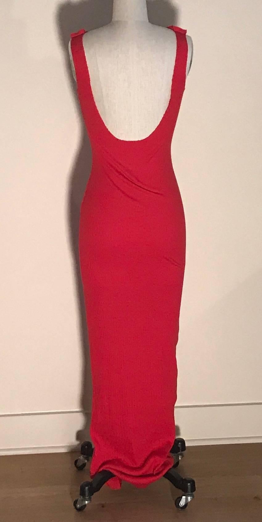 Patrick Kelly vintage 1980s long red rib knit dress with raw edge detail. Draped detail and exposed seam at shoulders, raw edge at back. 

From an auction of the Atelier of Patrick Kelly. 

No content label, probably a cotton stretch blend.

Best