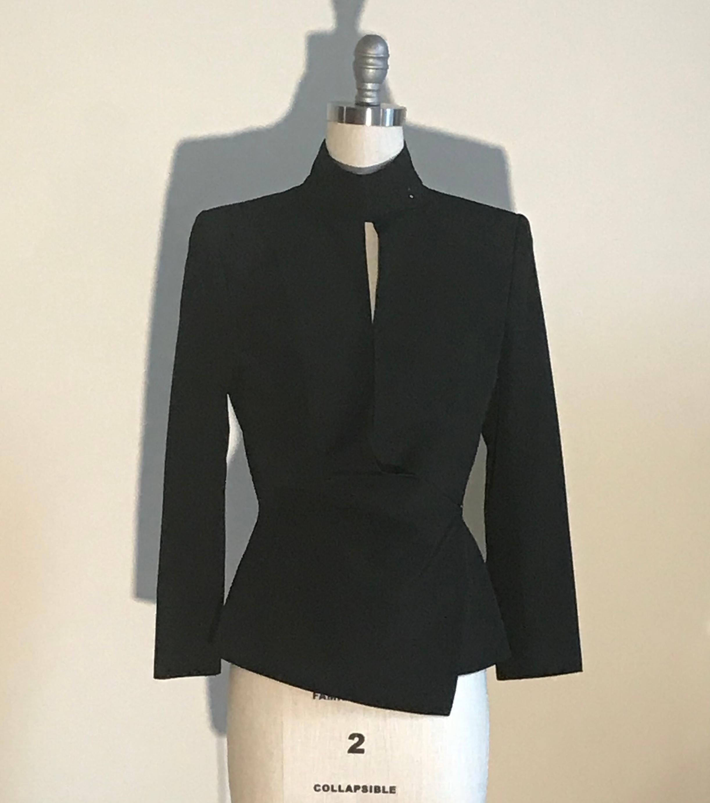 Yves Saint Laurent Rive Gauche black jacket with sexy draped detailing. Fastens at front with hidden button and gold hook and eye and with four gold hook and eyes at collar, creating a cut out detail. Light padding at shoulders. Most likely from the