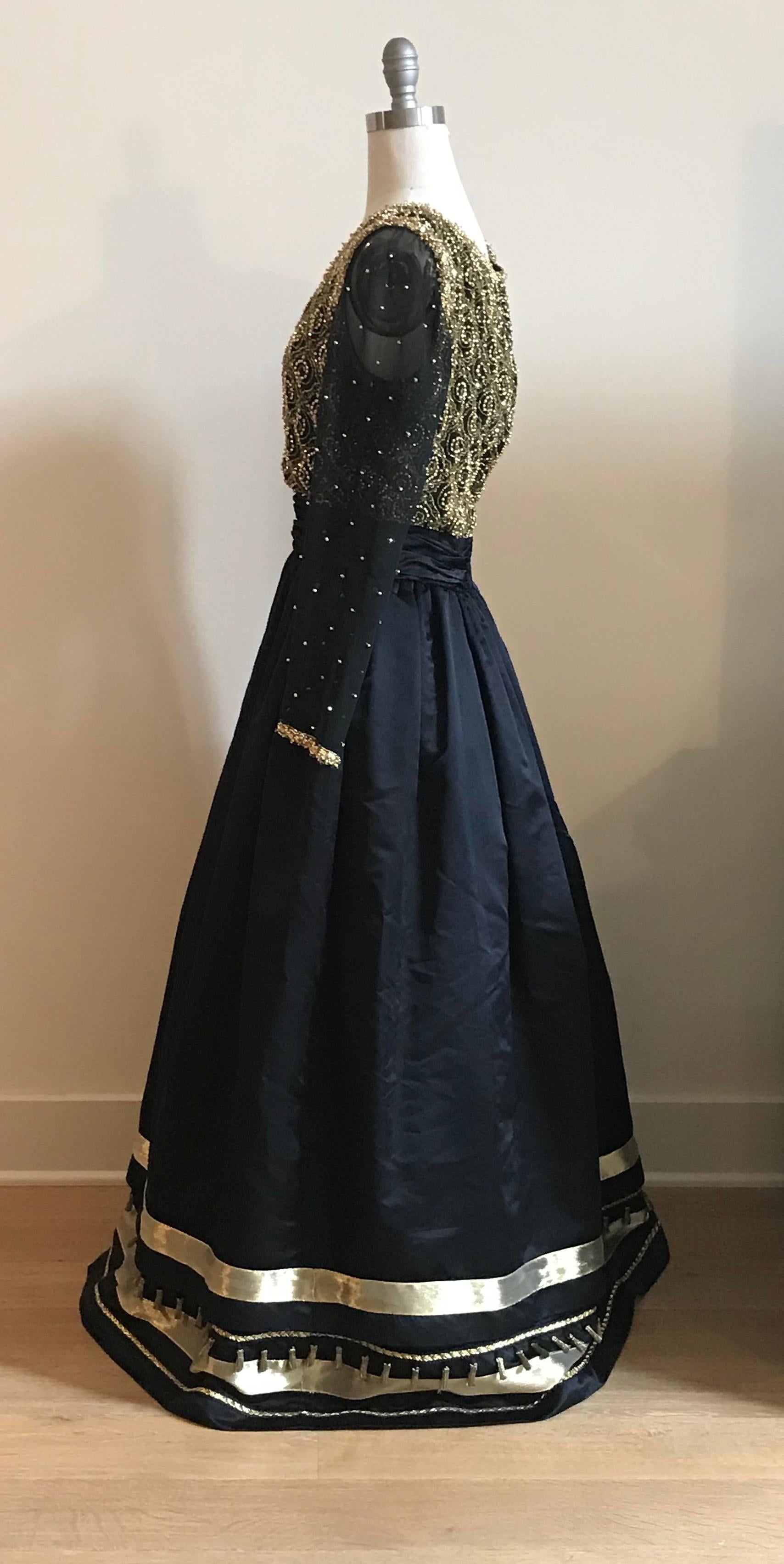 long sleeve black and gold gown