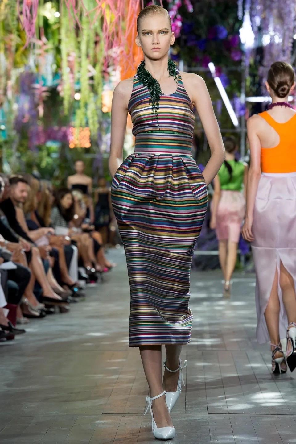 Christian Dior multicolor maxi skirt in a beautiful striped silk. Stripes in gold, purple, burgundy, green, navy and teal. Straight cut with voluminous bubble at hips. Side zip and hook and eye. 

Shown in a shorter length on the Spring 2014 runway,