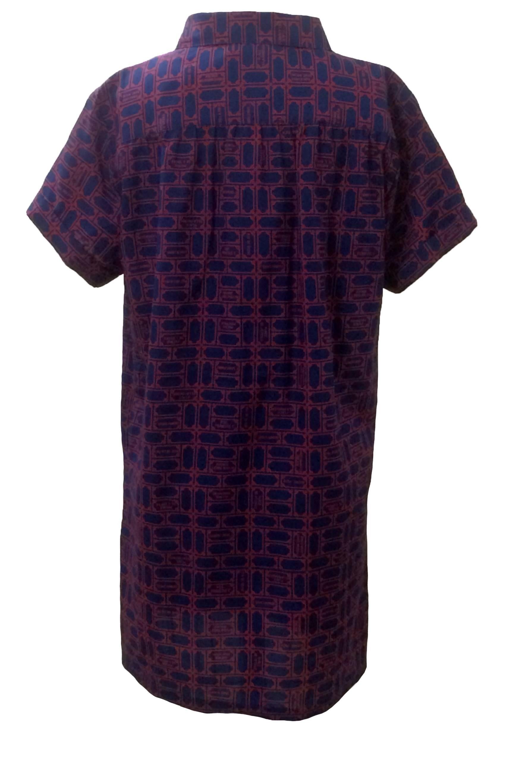 Lanvin 1970s blue & red shirt dress features Parisian street signs, including 'Boulevard Saint-Michel,' 'Rue de Siene,' 'Avenue Foch' and more. Front patch pocket at chest. Buttons up front. 

Made in USA by Union Workers of America.