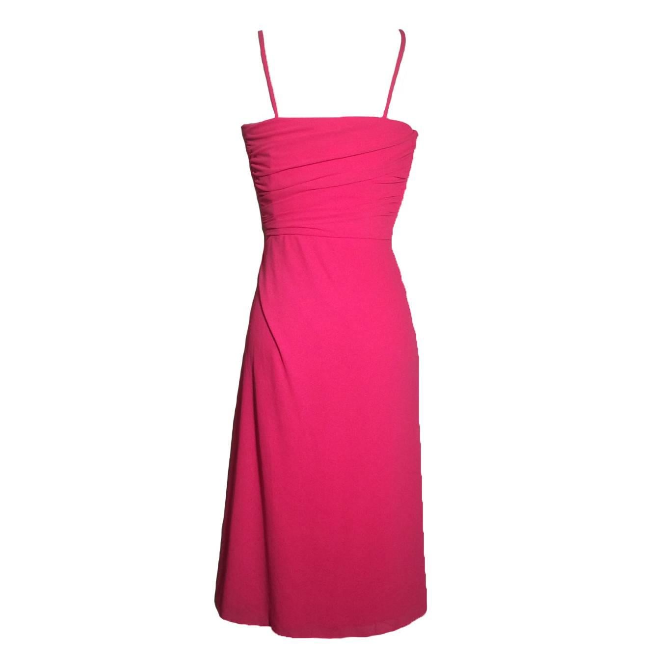 Vintage 70s Frank Usher draped jersey disco-style dress in bright pink. Ruched at side bodice. Back skirt wraps around over side zip to snap and tie at opposite side, creating a faux-wrap effect.

Size not listed, fits like XS/0. Lots of stretch,