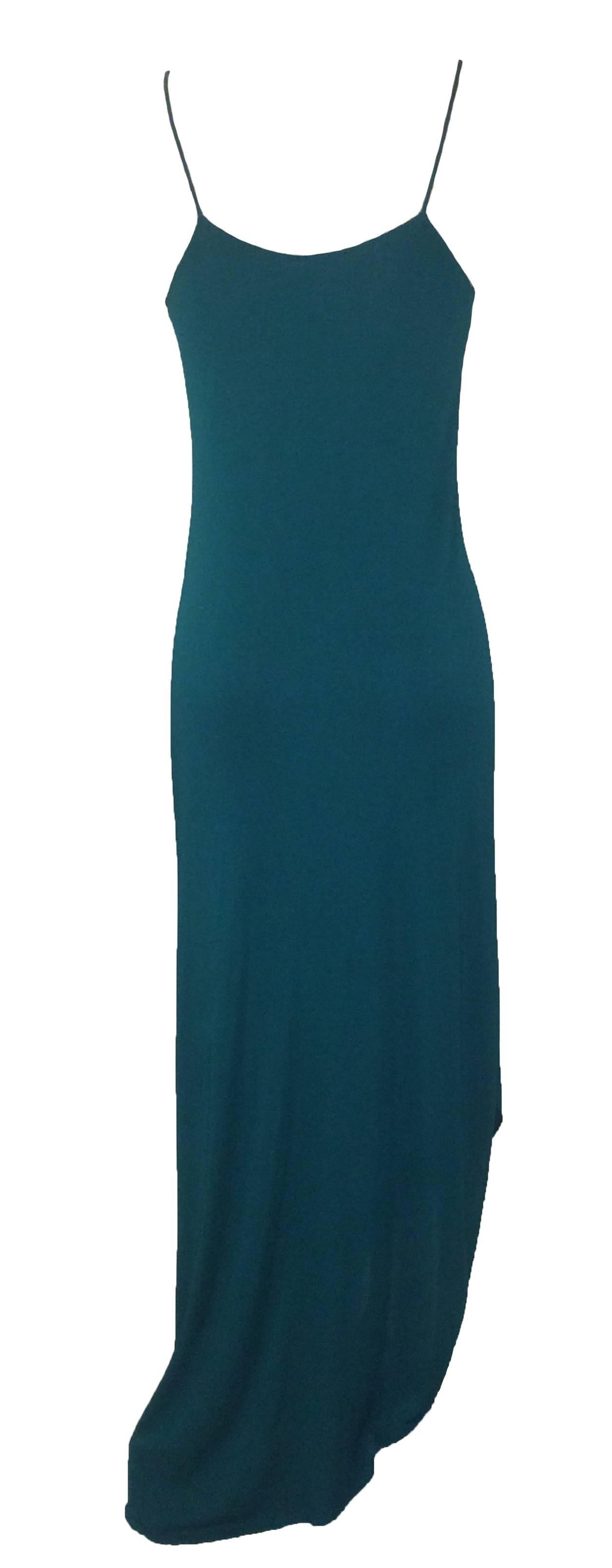 Iconic Stephen Burrows vintage 70s teal jersey bias cut dress with spaghetti straps and signature lettuce hem. Amazing beadwork at top bodice.

Material: No content tag, feels like a synthetic jersey.

Size: No size tag, would best fit an XS or