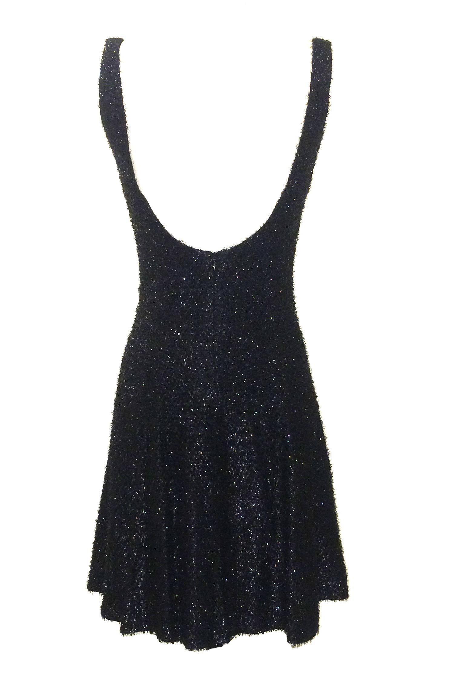 Stephen Sprouse 1980's black backless skater-shaped dress in a honeycombed metallic fringe fabric. Back zip.

80% rayon, 20% polyester.
Fully lined in 100% acetate.

Made in Korea.

Size 8.
Bust 34