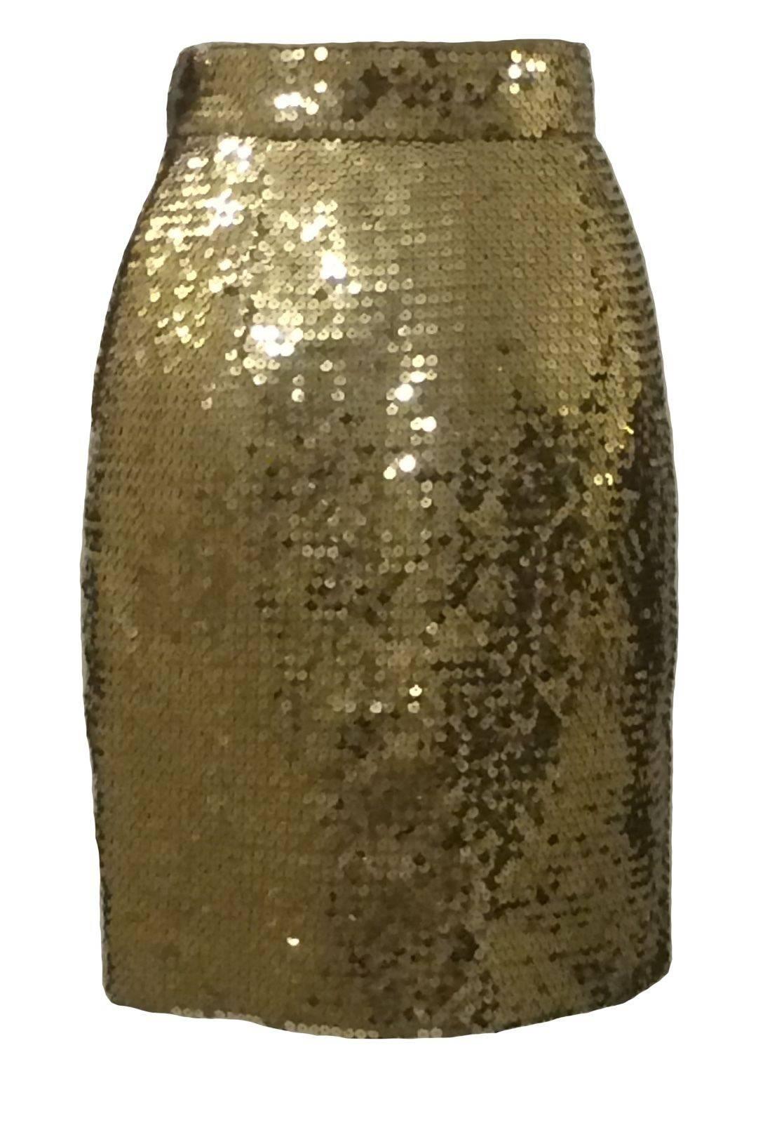 Moschino Couture! vintage early 90's gold sequin pencil skirt.

Side zip and snap with faux button fastener at waist.

100% polyester. Fully lined in 60% acetate, 40% rayon. 

Labelled IT 44, US 10. Runs small. See measurements.
Waist: