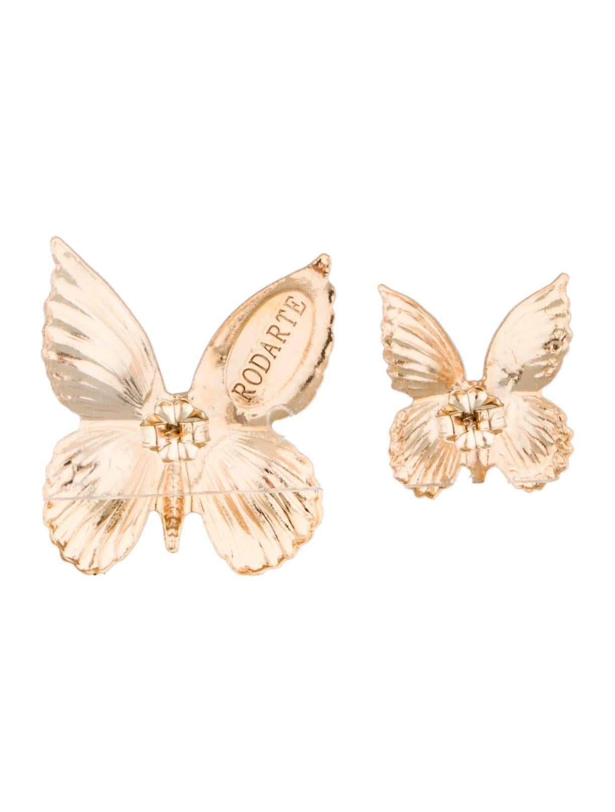Rodarte gold tone butterfly pierced earrings. 

Asymmetrical size give these earrings the whimsical Rodarte touch.

Large earring approximately 1