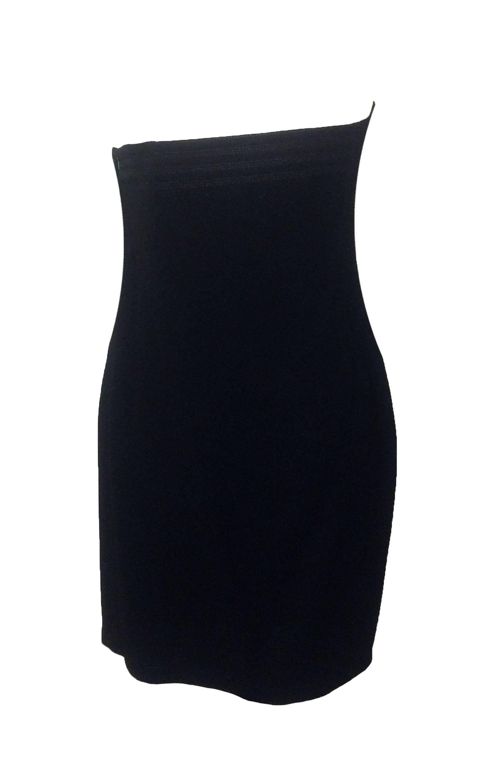Gianni Versace 90s little black dress with an asymmetrical curve and seamed detailing at chest. Interior boning, side zip. Lining at bust that fastens at side with three buttons for support/shaping.

(Was shown on the runway with an asymmetrically