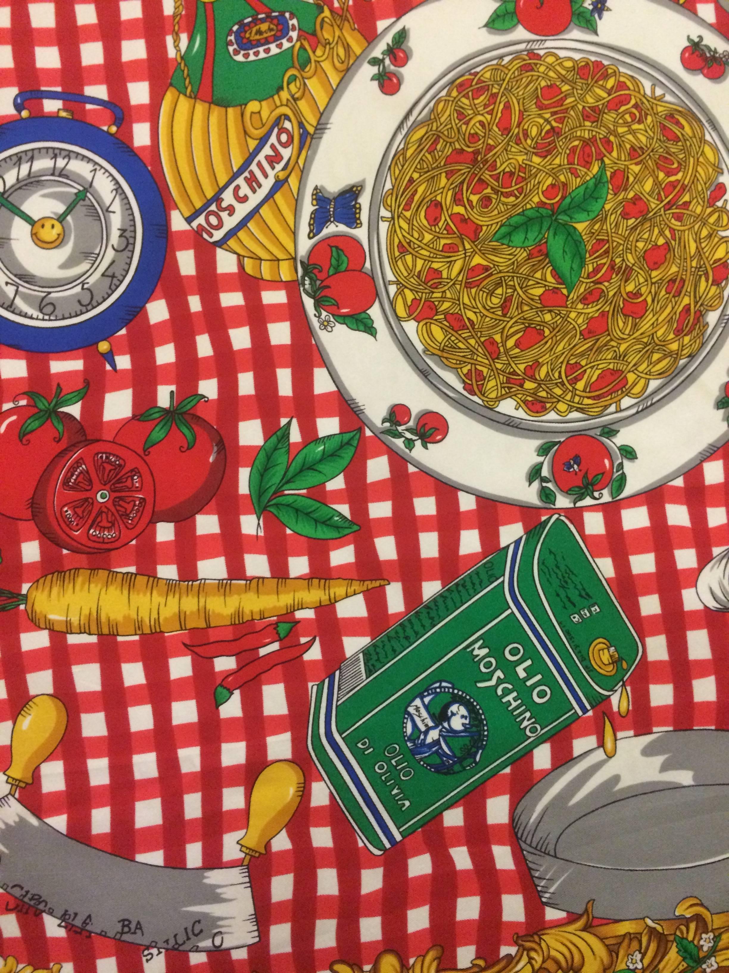 Moschino 90s Italian dinner print scarf shoes a checkered table cloth covered with Moschino branded pasta ingredients and wine.

Fabric tag removed, feels like 100% silk. 

34