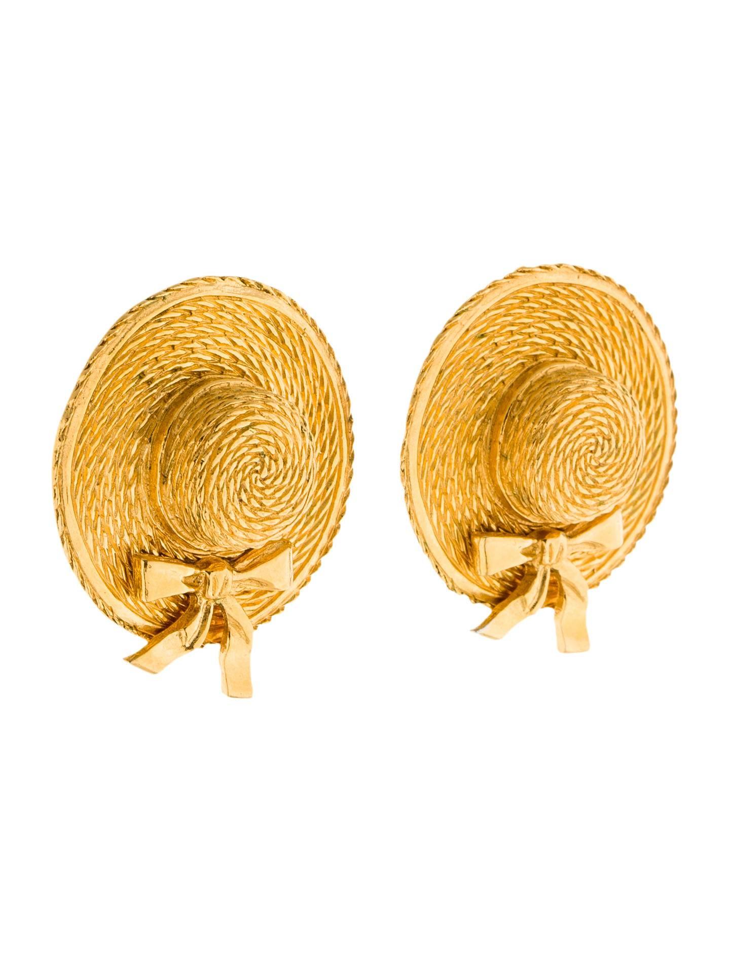 These Chanel vintage 90's gold tone sun hat clip-on earrings reference Coco's beginnings in millinery. 

Approximately 1 1/2
