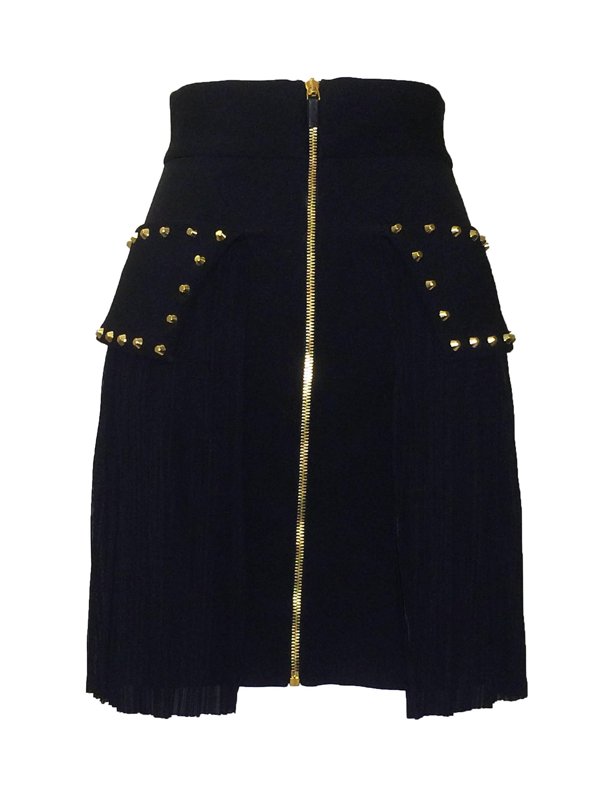 Versace black pencil skirt with pleated overlay and gold tone studs. Exposed gold zip at back. 

48% polyamide, 34% polyester, 18% elastane.

Made in Italy.

Size IT 38, approximately US 2. Stretchy, measurements taken unstretched.
Waist 25"