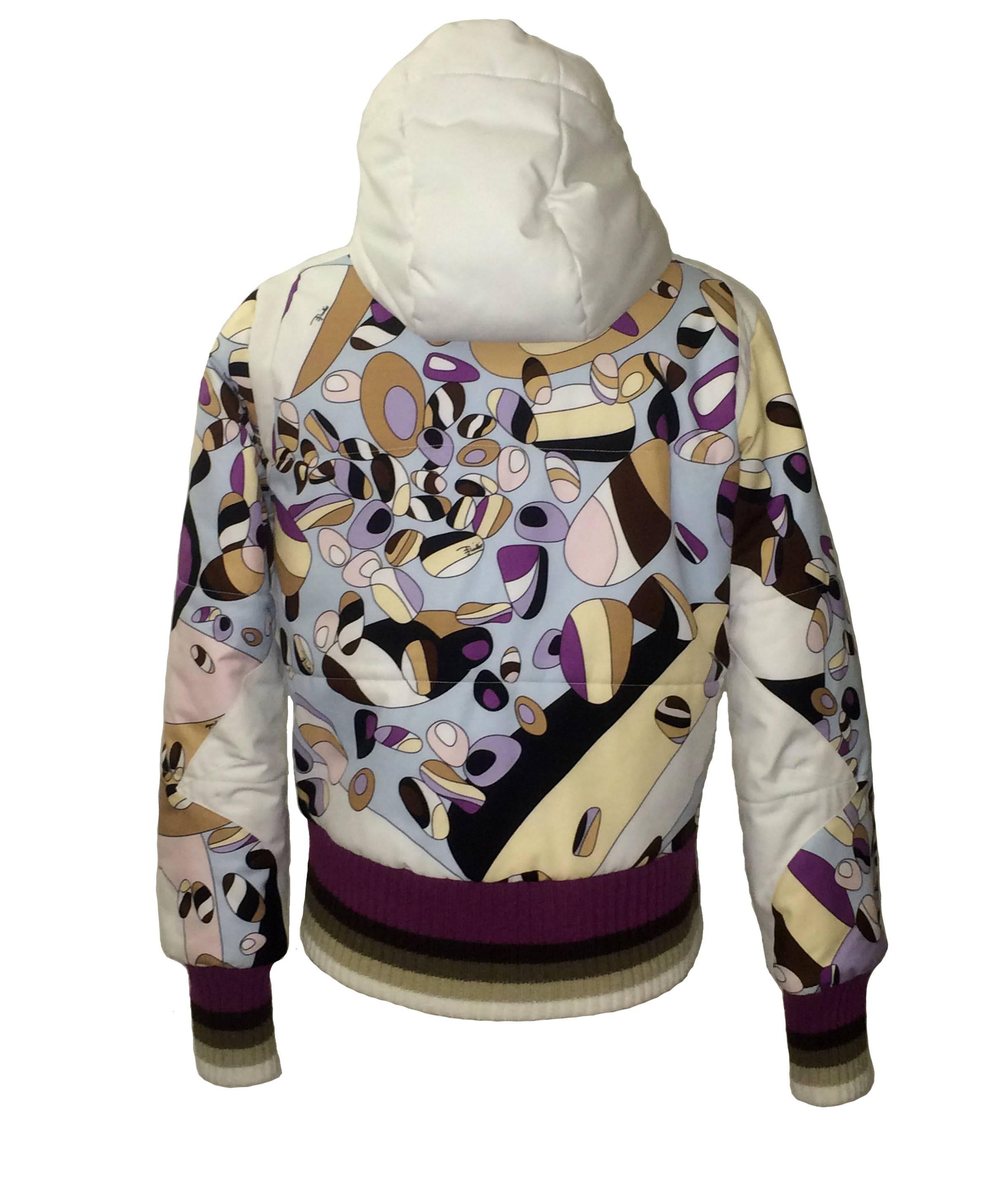 Emilio Pucci for Rossignol Pure Mountain Company hooded ski jacket in white, violet, tan, and pink Pucci print. Zippered pockets at front and one at interior. 

Signed 'Pucci' at zipper hardware and 'Emilio' throughout print.

'Windstopper'
