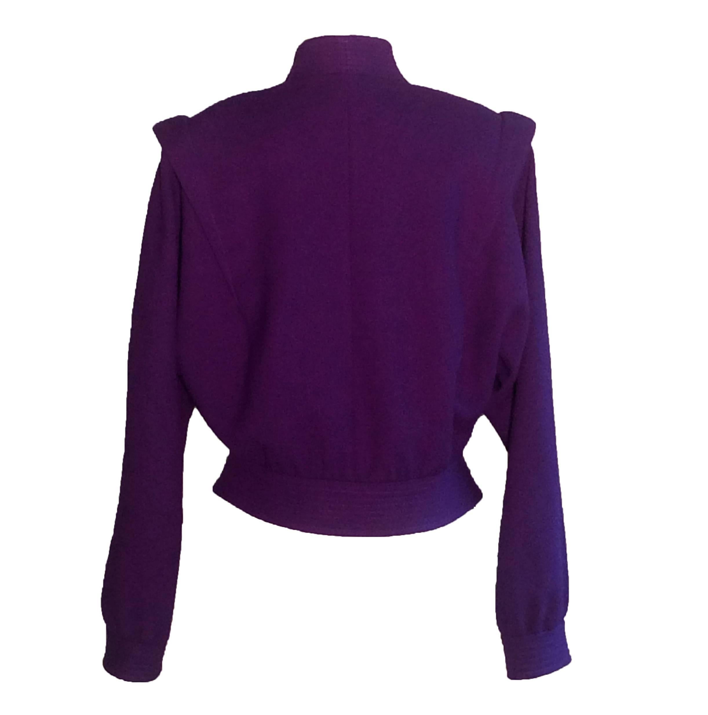 Adolph Schuman for Lilli Ann grape purple 70's short blouson jacket with button front and awesome shoulder detailing. Four buttons at front, padding at shoulders.

No content label, seems like a wool crepe.
Fully lined.

No size tag, best fits a