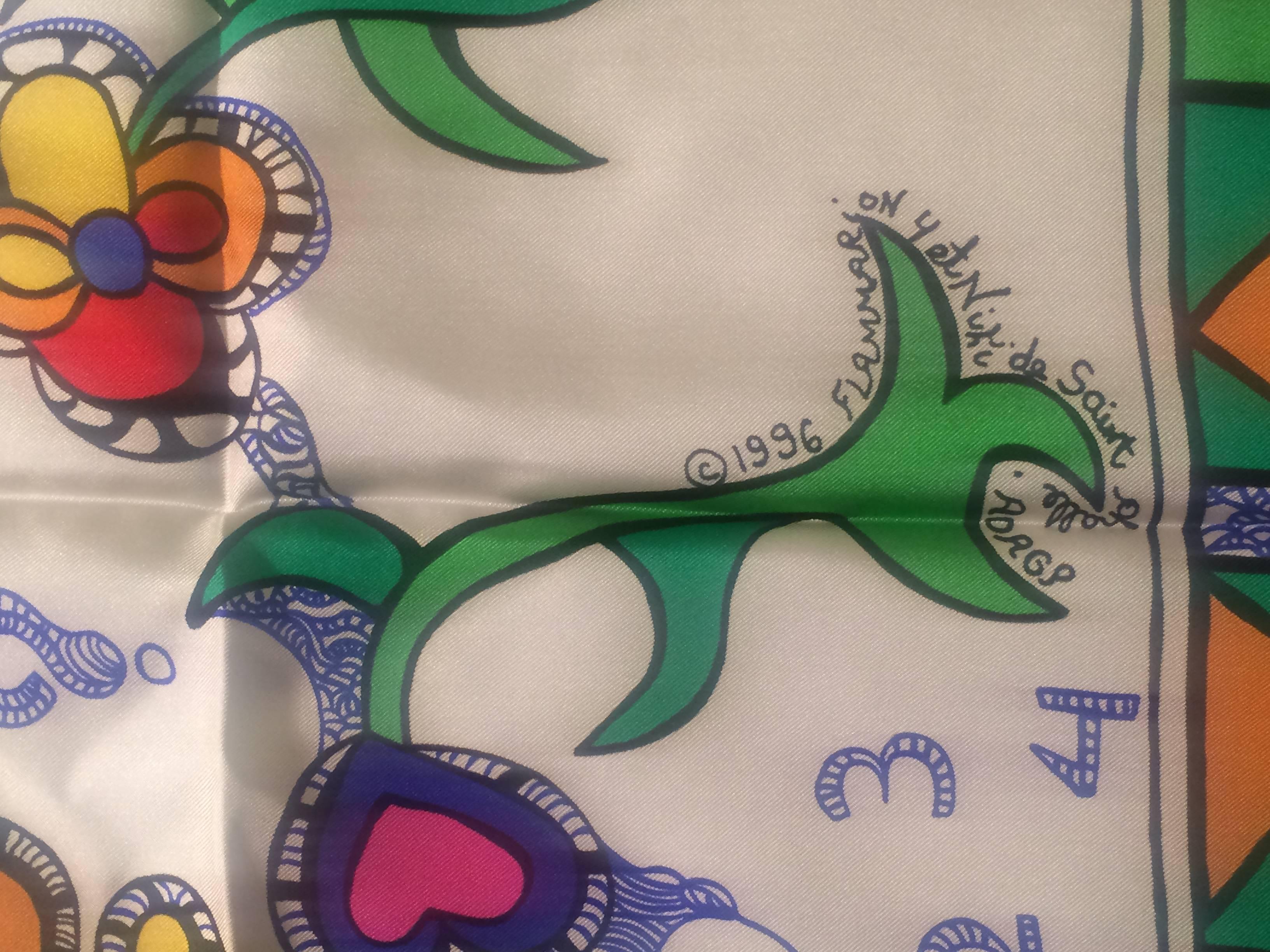 Niki de Saint Phalle silk scarf in white and multi 'Le Rossignol' pattern, copyright 1996. 

100% silk.

Approximately 34