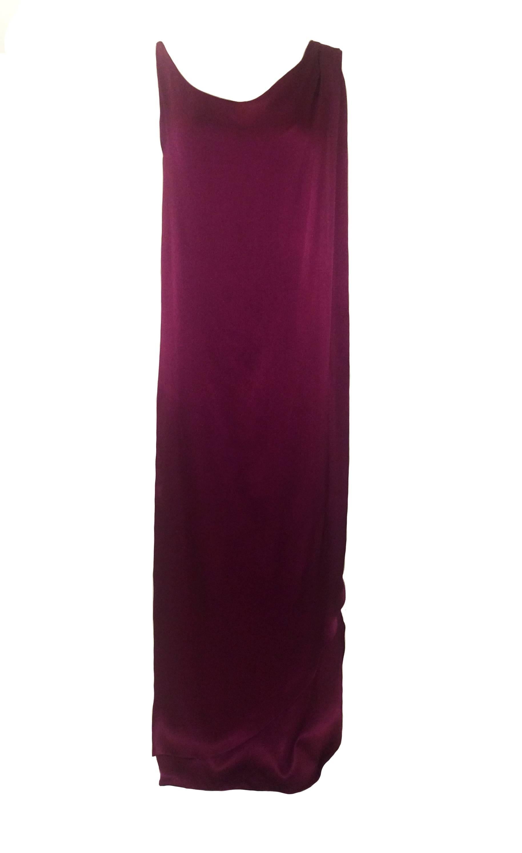 Giorgio Sant'Angelo late 1970's cranberry red column gown with asymmetrical detailing. Draped front panel and hanging weighted draped back. Unlined. Sold at Neiman Marcus (Neiman's tag intact.)

Content unknown (silk charmeuse?) 

Labelled size 10,