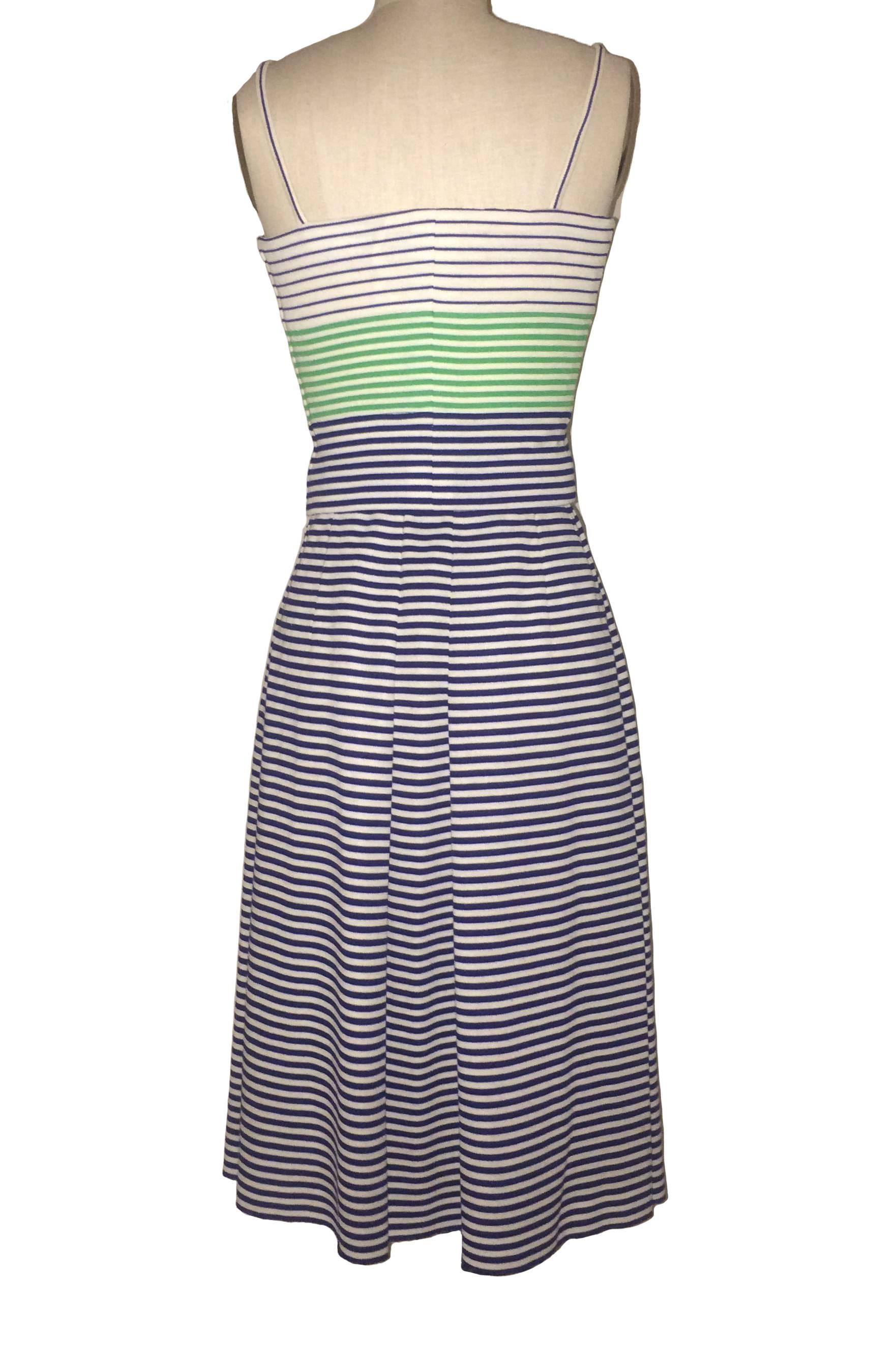 Lanvin vintage 1960s blue, white and green cropped spaghetti strap top with side zip. Wired at non-zip side for structure. 

Blue and white striped full skirt with front and black center pleats. Metal side zip with double hook and eye and button.